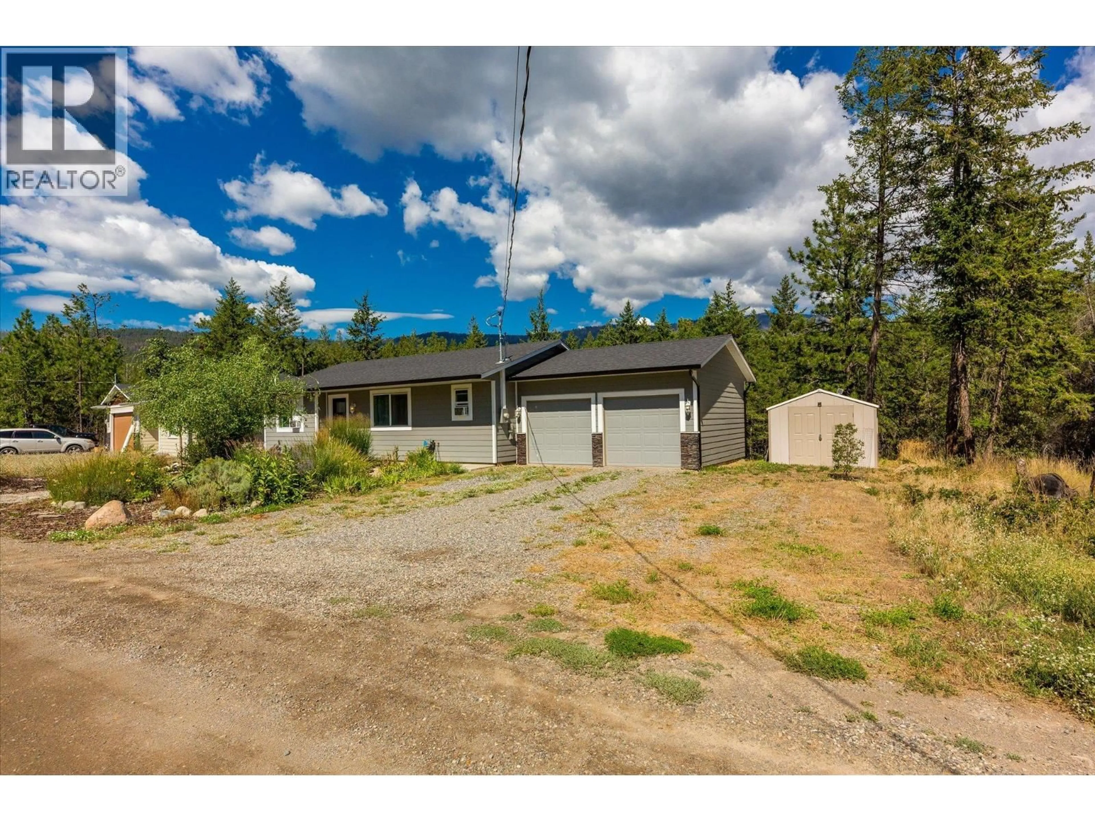 A pic from outside/outdoor area/front of a property/back of a property/a pic from drone, street for 634 MUIR ROAD, Kelowna British Columbia V1Z3W1