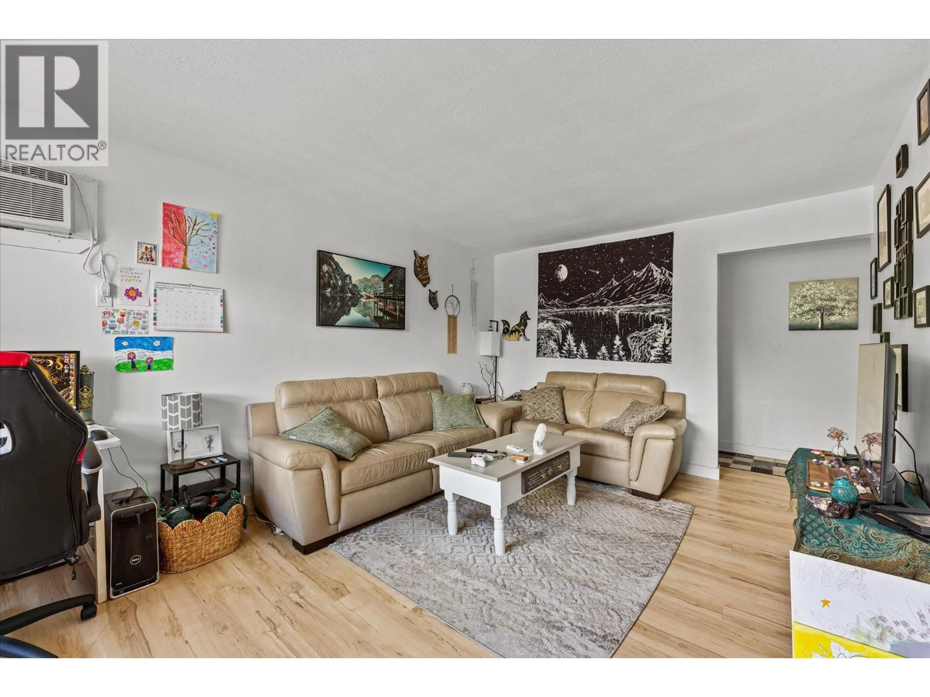 Living room with furniture, wood/laminate floor for 228 - 3505 38 STREET, Vernon British Columbia V1T6X1