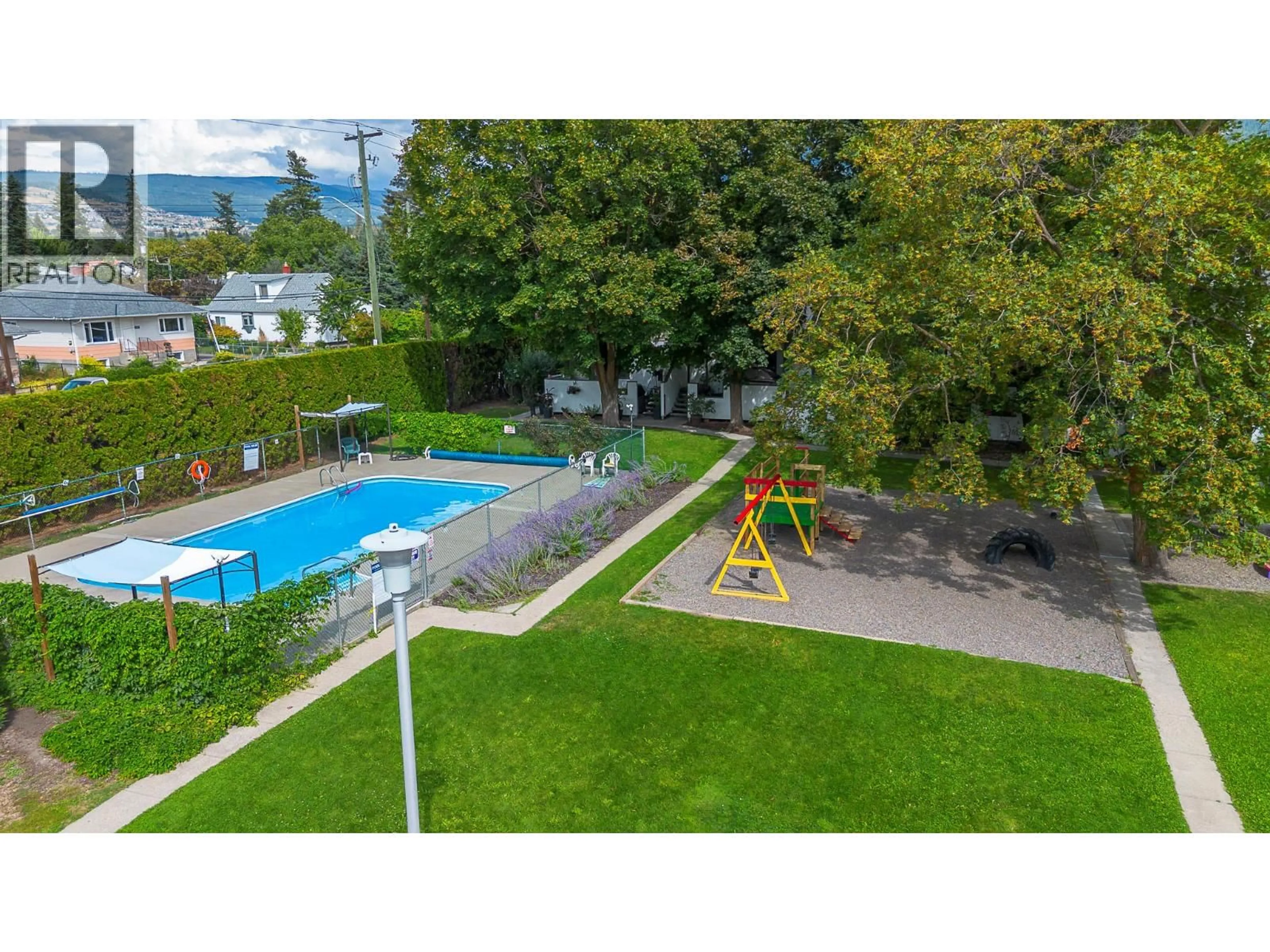 A pic from outside/outdoor area/front of a property/back of a property/a pic from drone, unknown for 101 - 2100 43 AVENUE, Vernon British Columbia V1T3K5