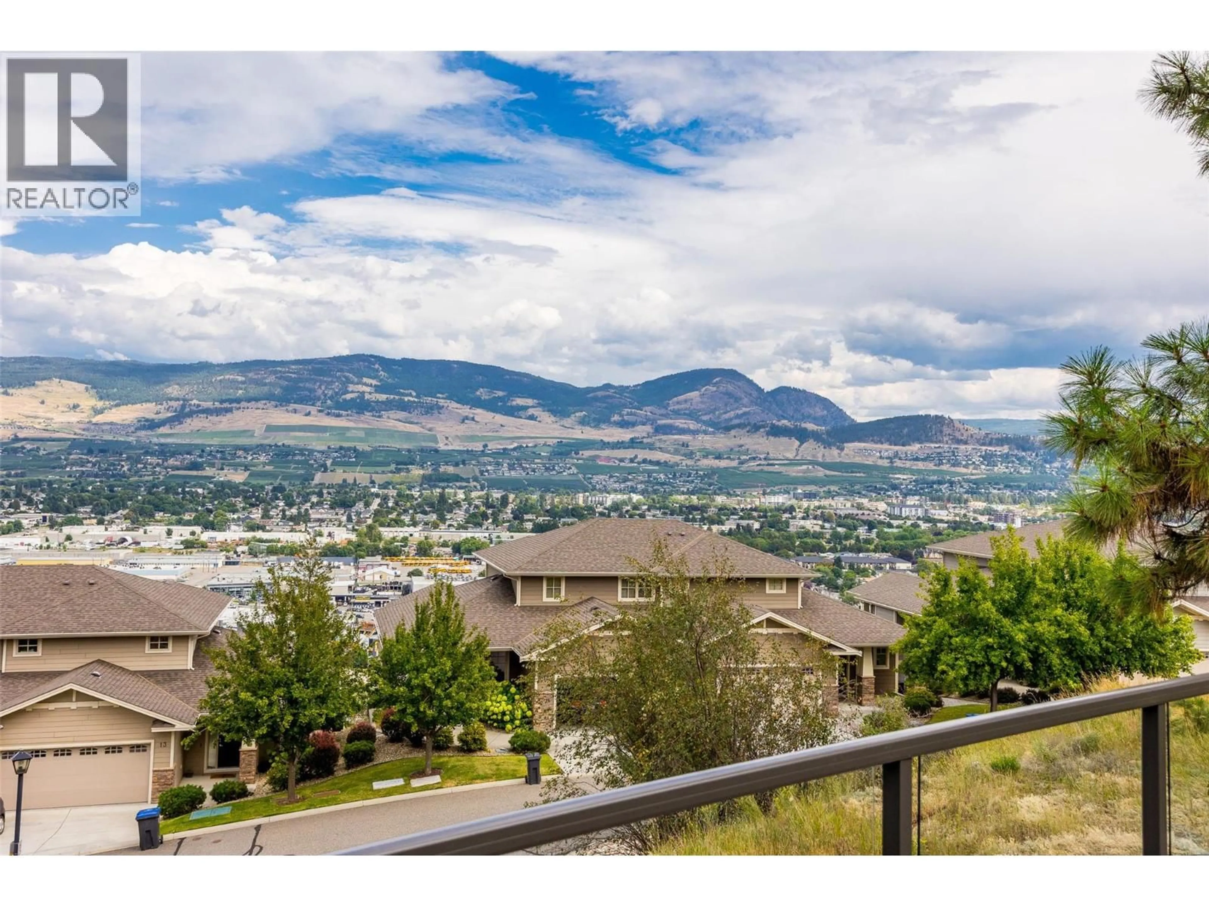 A pic from outside/outdoor area/front of a property/back of a property/a pic from drone, mountain view for 975 MONASHEE PLACE, Kelowna British Columbia V1V1J5