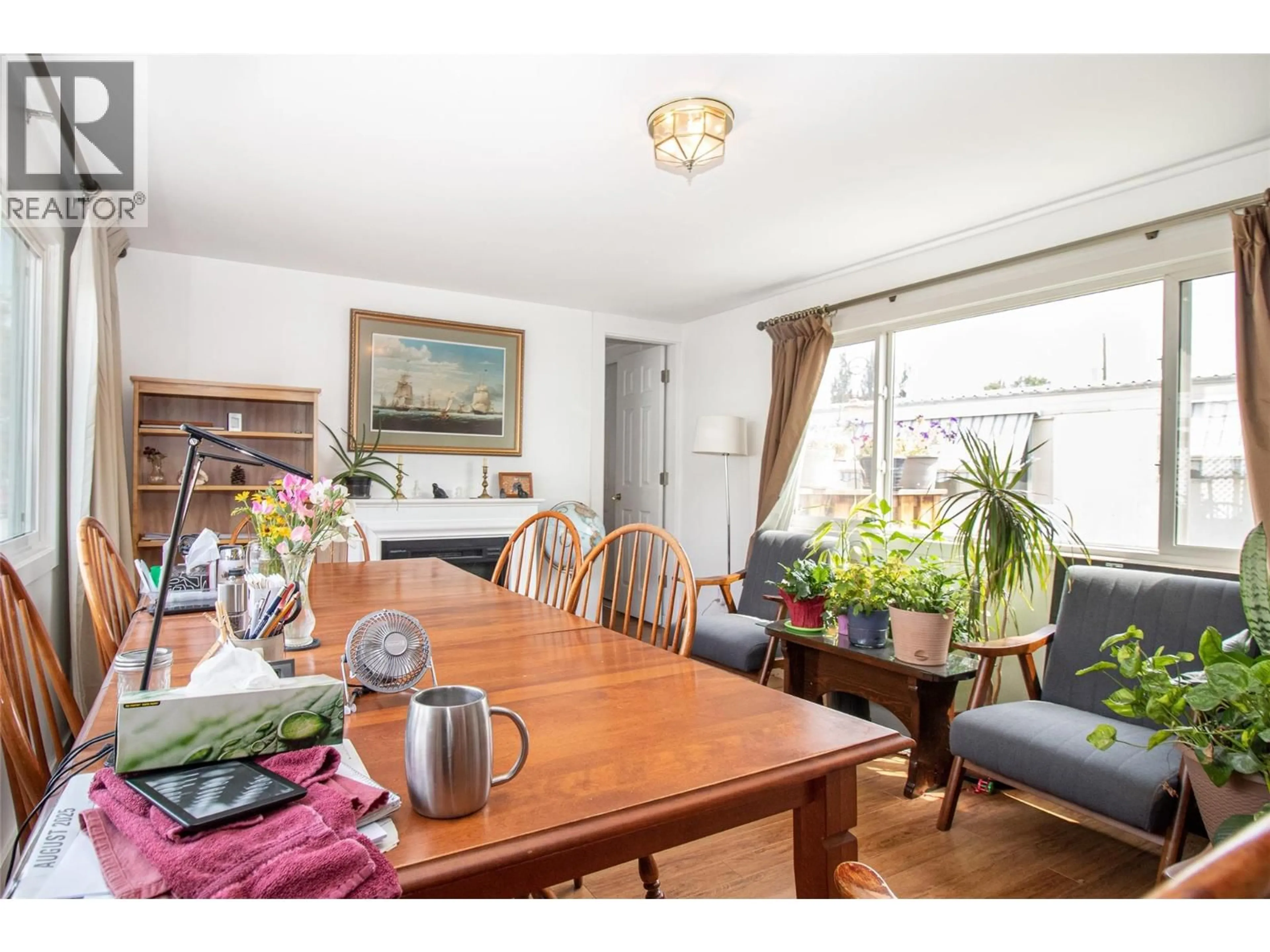 Dining room, wood/laminate floor for 134 - 3745 LAKESHORE ROAD, Kelowna British Columbia V1W3K4