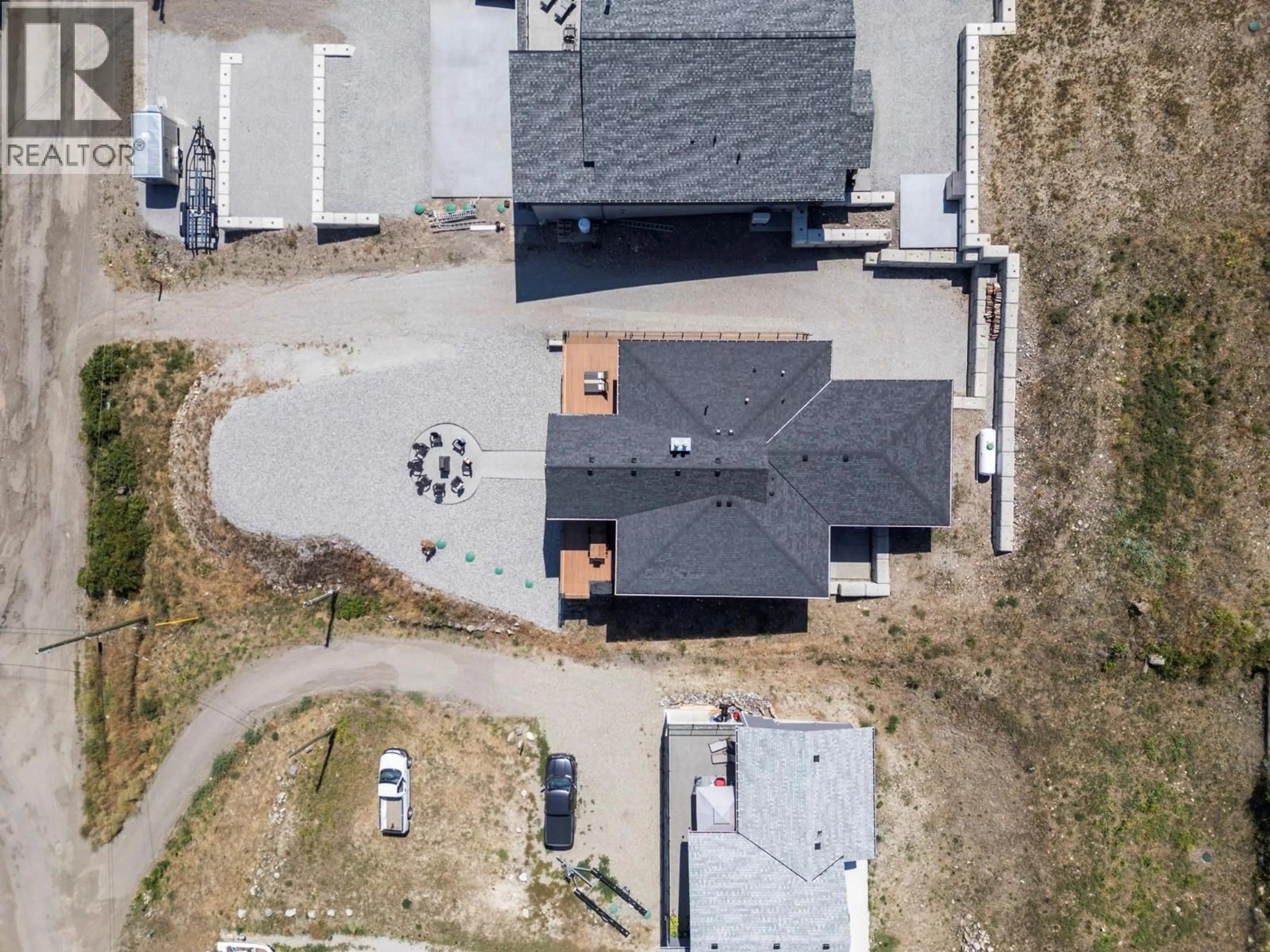 A pic from outside/outdoor area/front of a property/back of a property/a pic from drone, street for 8 KENYON ROAD, Vernon British Columbia V1H2C6