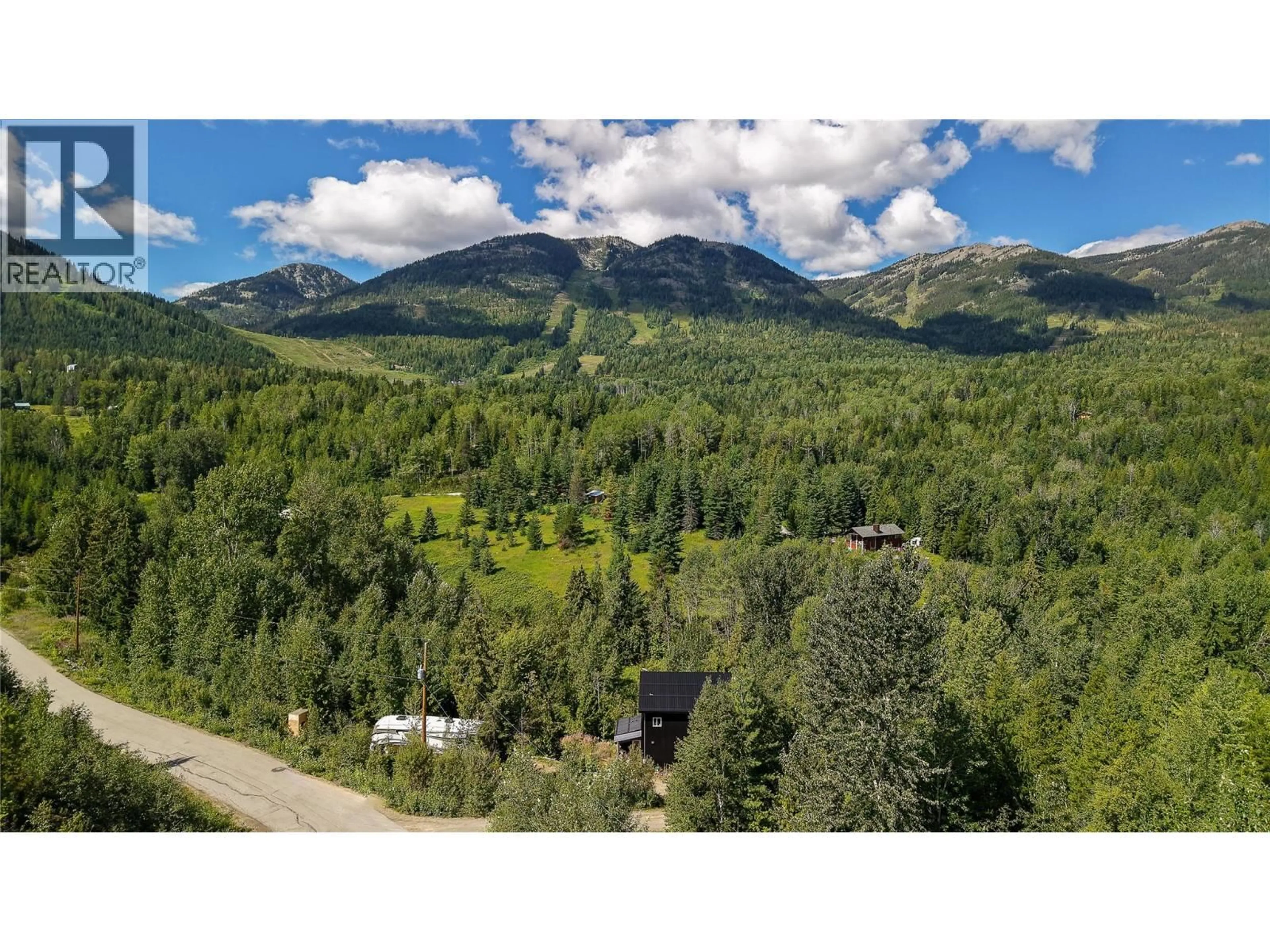 A pic from outside/outdoor area/front of a property/back of a property/a pic from drone, mountain view for 300 RICHIE ROAD, Rossland British Columbia V0G1Y0