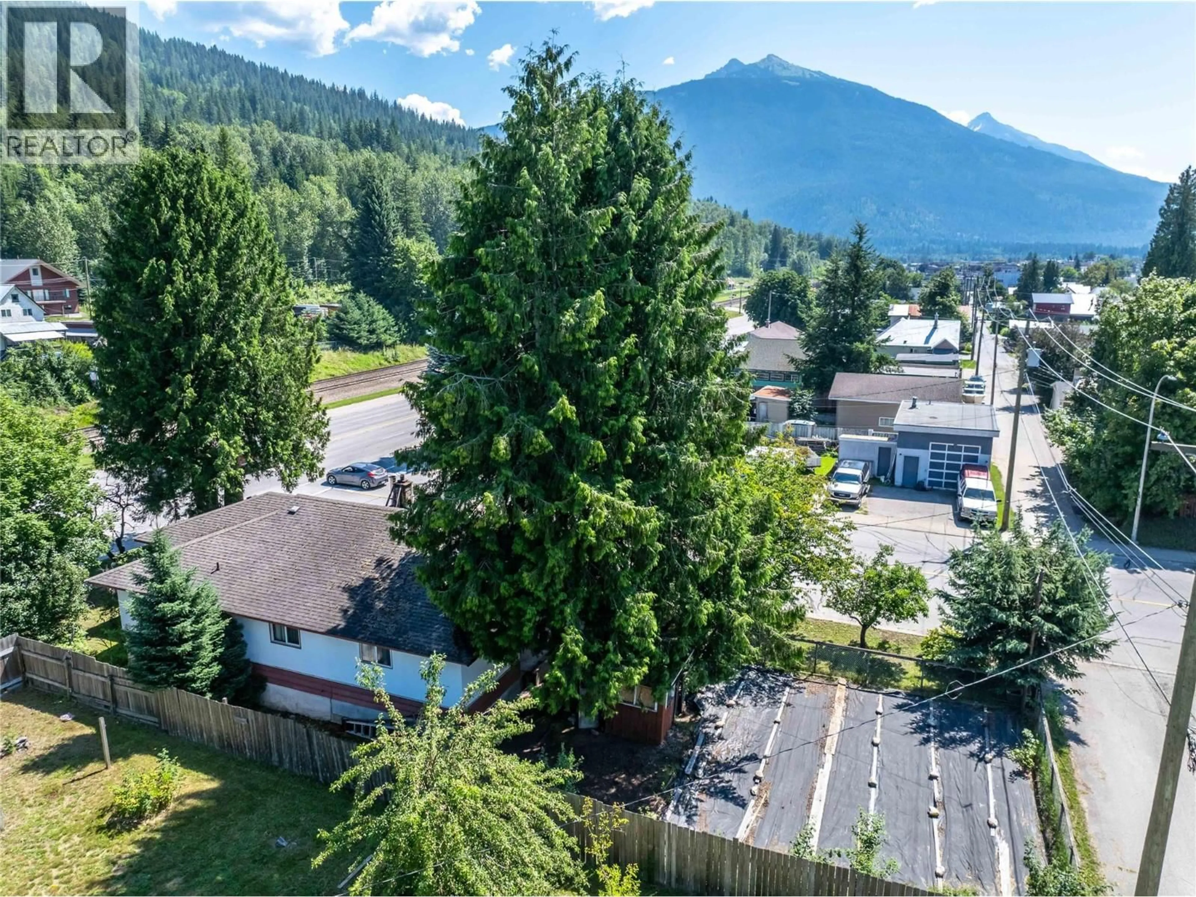 A pic from outside/outdoor area/front of a property/back of a property/a pic from drone, mountain view for 1001 VICTORIA ROAD, Revelstoke British Columbia V0E2S0