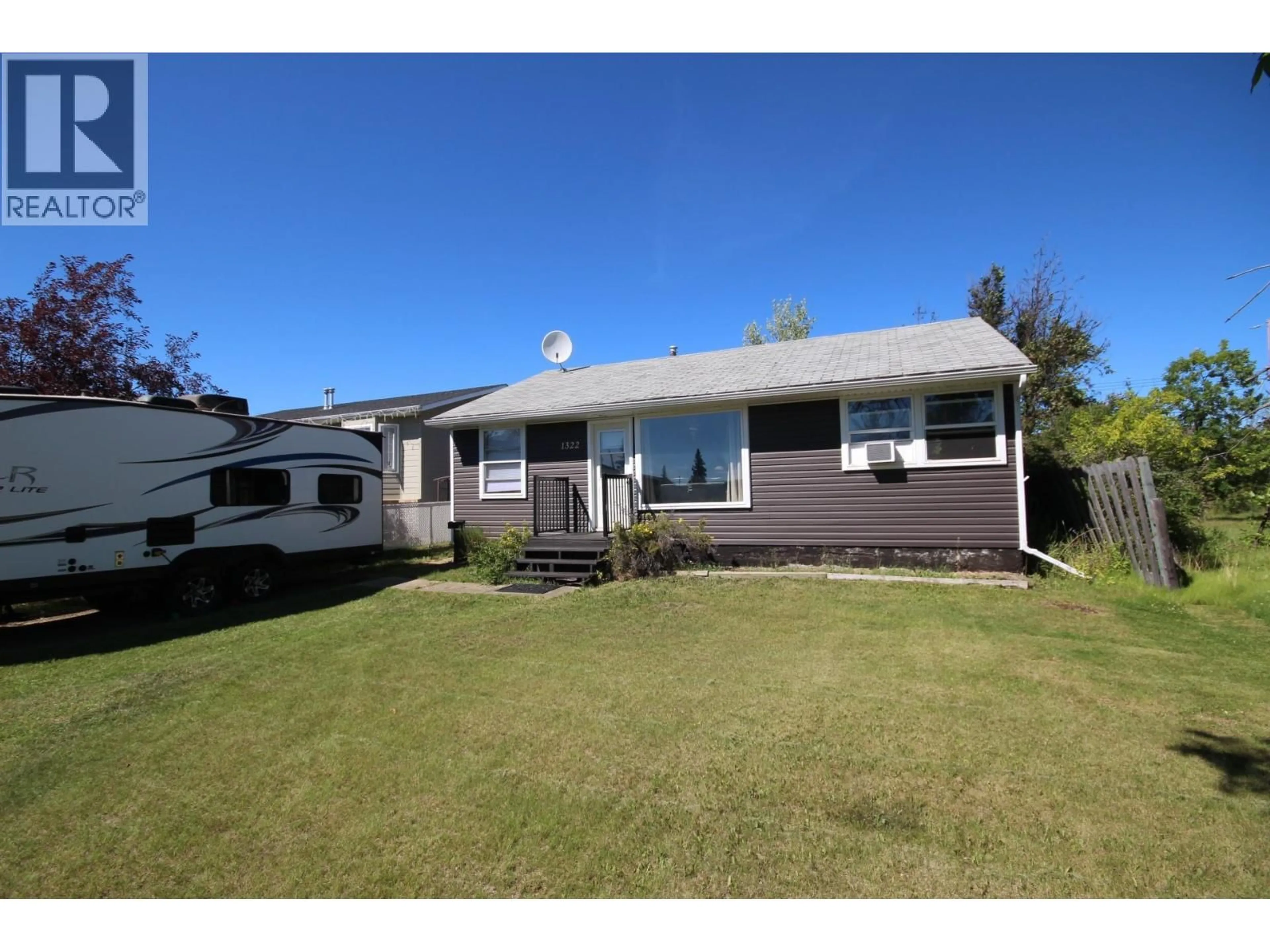 Home with vinyl exterior material, street for 1322 106 AVENUE, Dawson Creek British Columbia V1G2P1