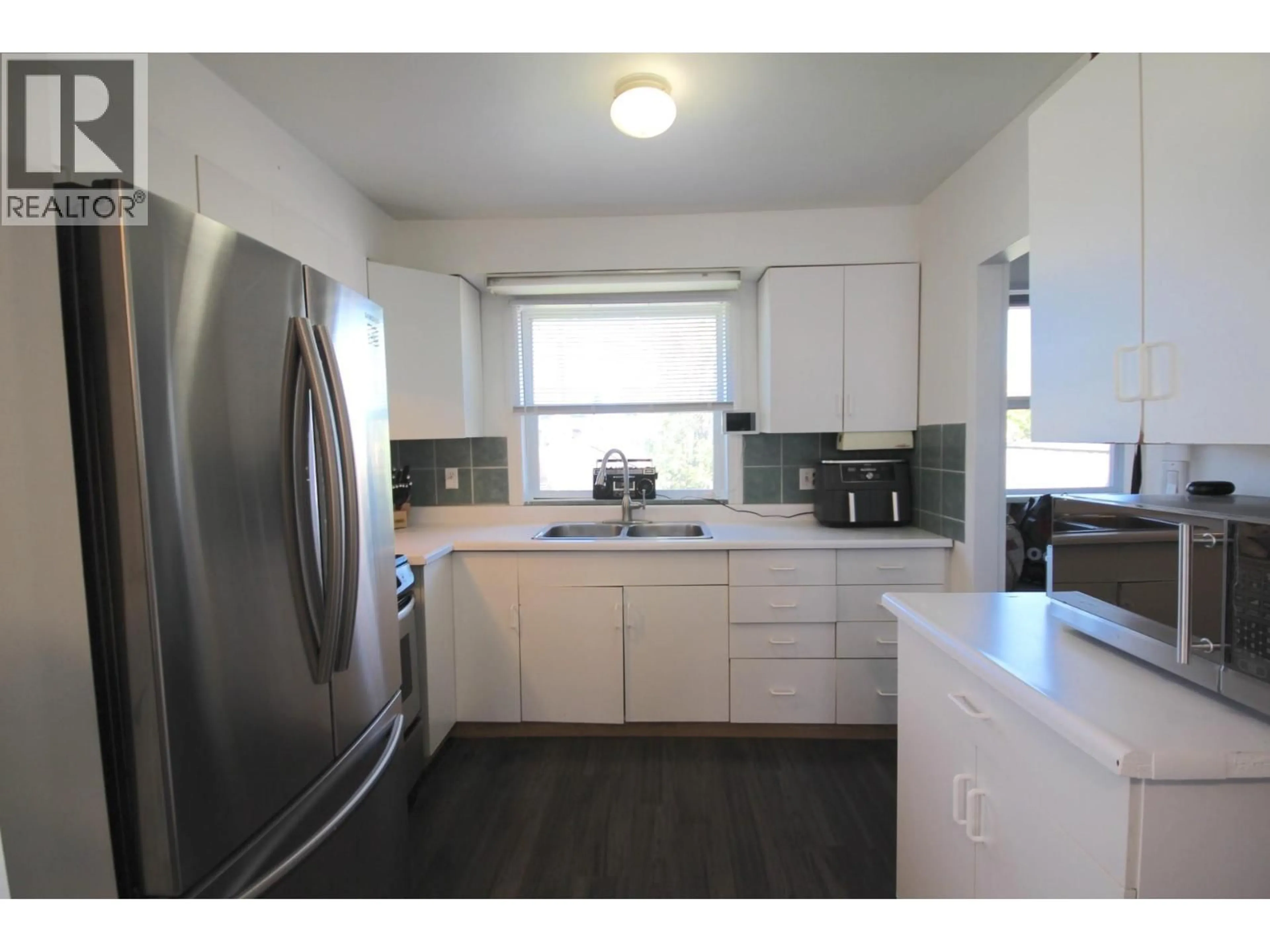 Standard kitchen, wood/laminate floor for 1322 106 AVENUE, Dawson Creek British Columbia V1G2P1