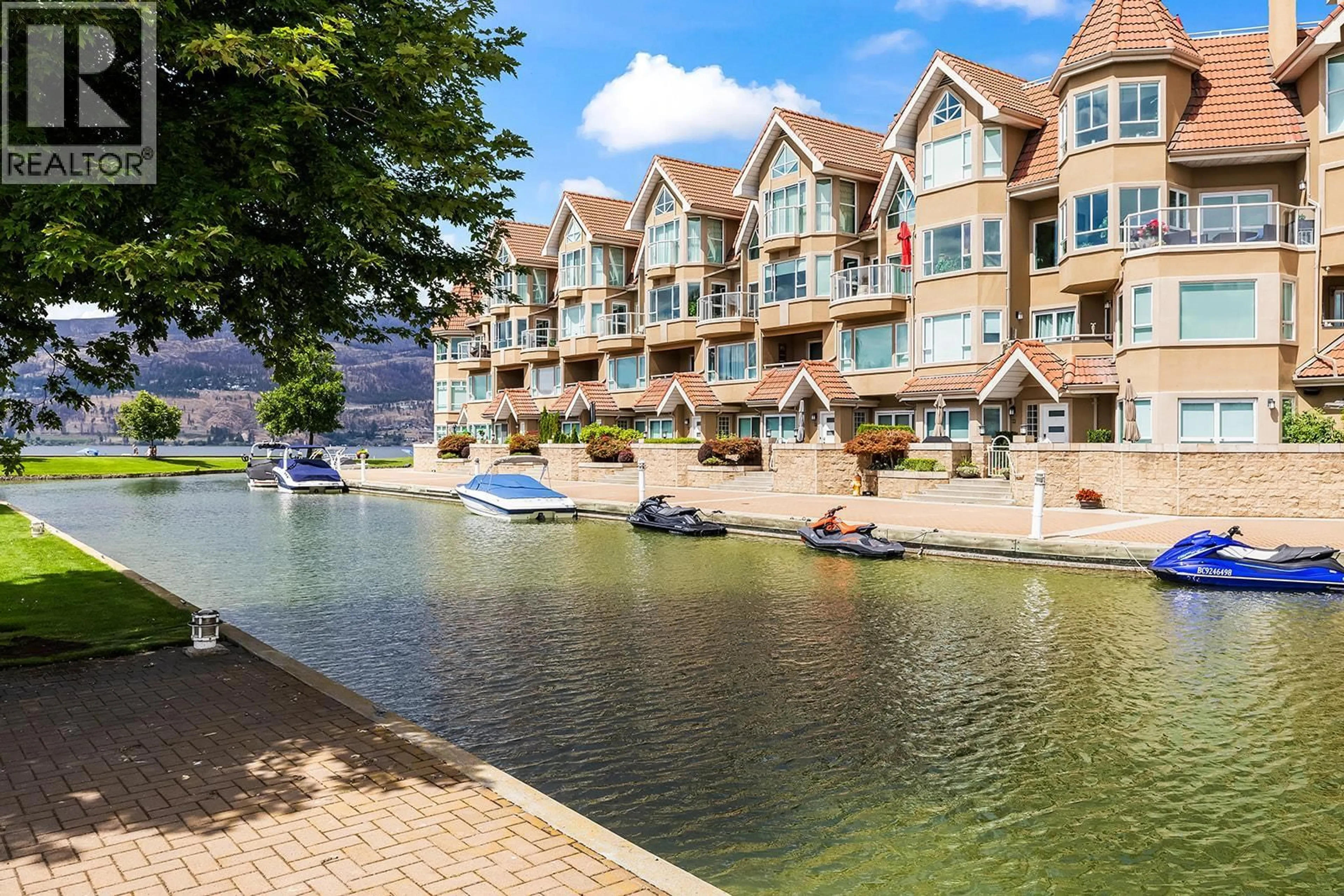 A pic from outside/outdoor area/front of a property/back of a property/a pic from drone, water/lake/river/ocean view for 117 - 1156 SUNSET DRIVE, Kelowna British Columbia V1Y9R7
