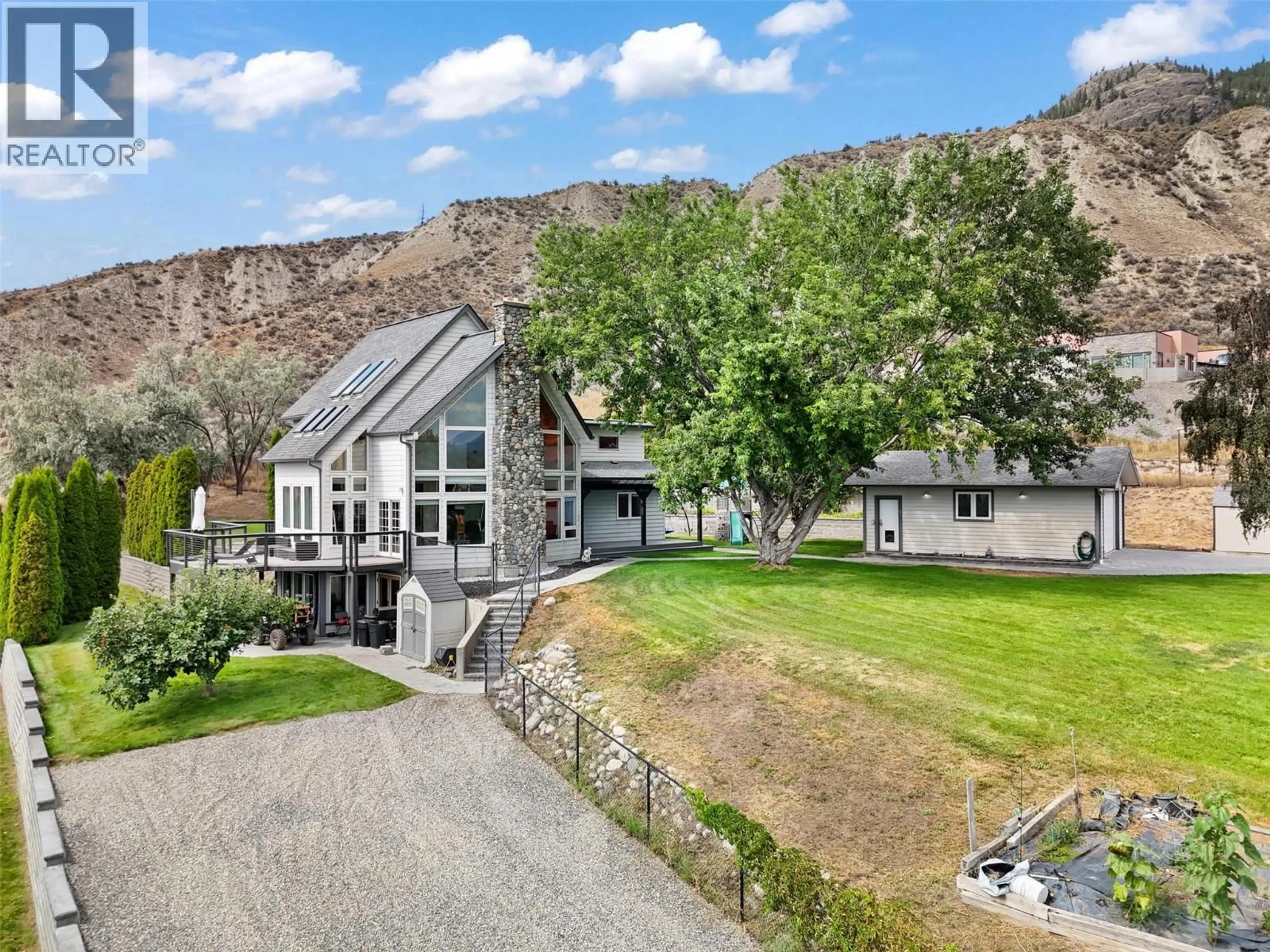 A pic from outside/outdoor area/front of a property/back of a property/a pic from drone, mountain view for 3083 SHUSWAP ROAD, Kamloops British Columbia V2H1T1