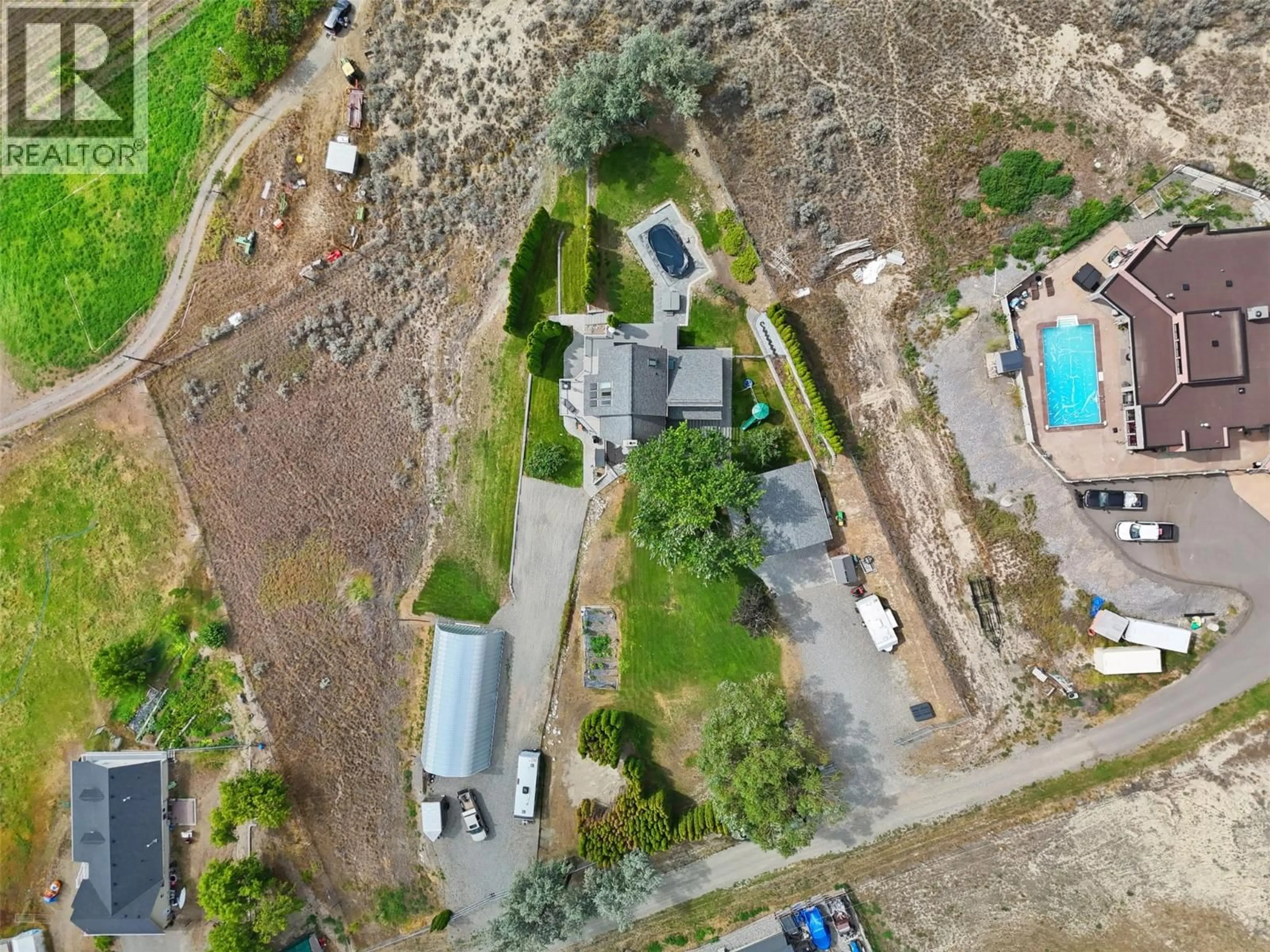 A pic from outside/outdoor area/front of a property/back of a property/a pic from drone, street for 3083 SHUSWAP ROAD, Kamloops British Columbia V2H1T1