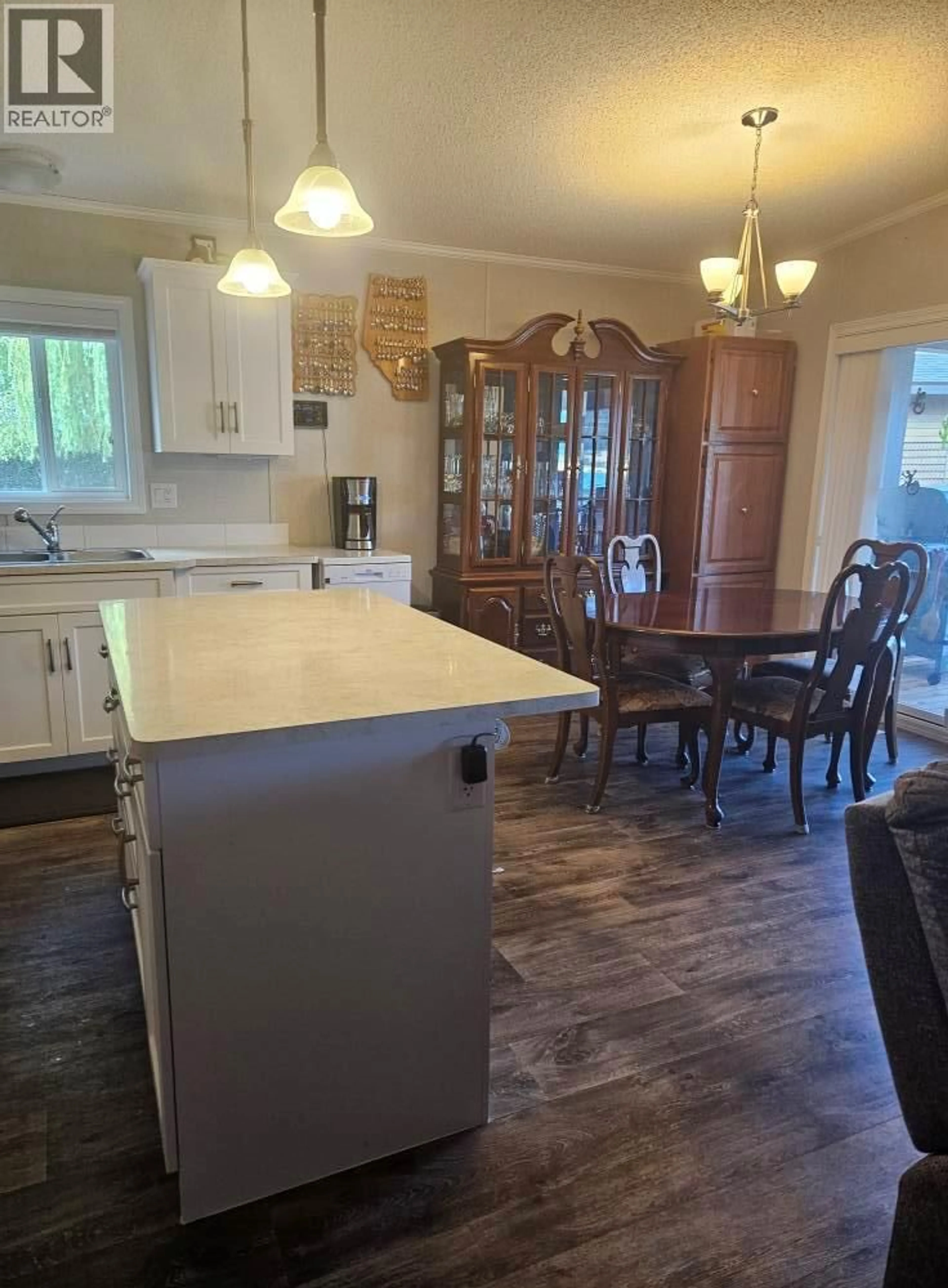 Open concept kitchen, wood/laminate floor for 32 VICTORIA ROAD, Vernon British Columbia V1H2A9