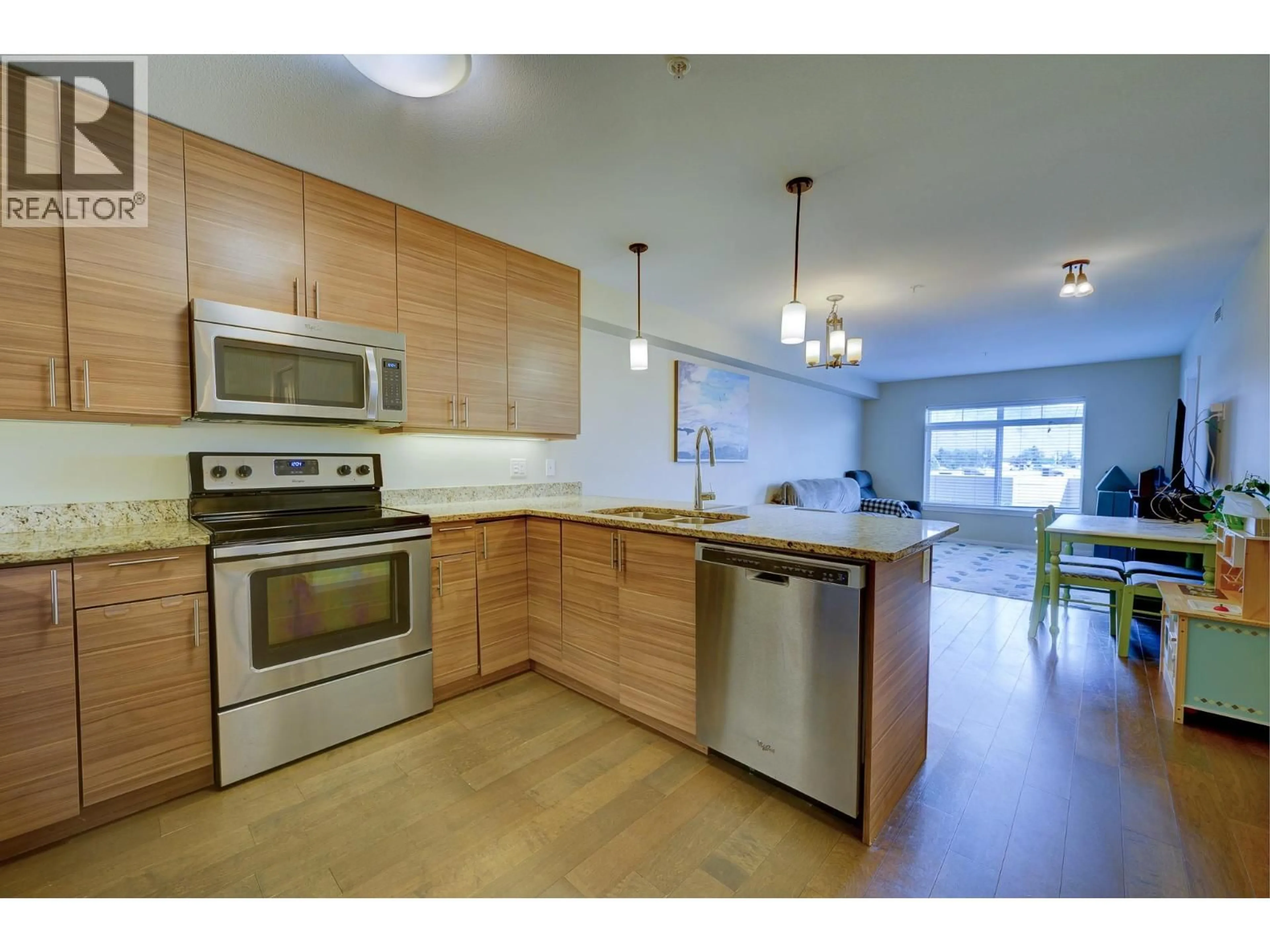 Open concept kitchen, wood/laminate floor for 324 - 689 TRANQUILLE ROAD, Kamloops British Columbia V2B0C7