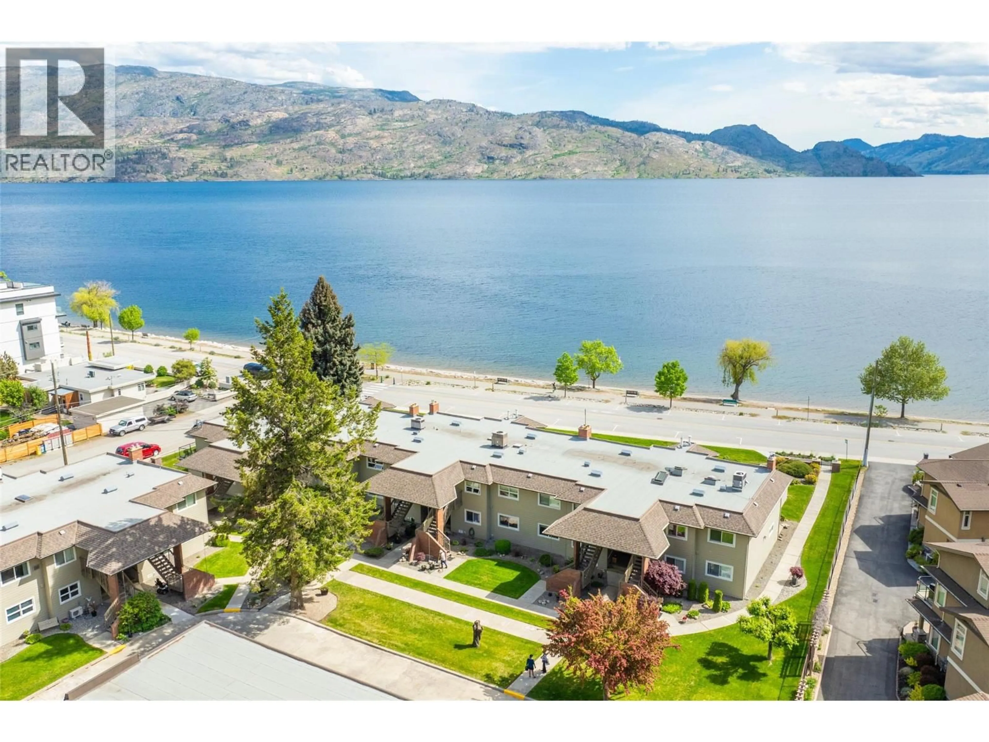 A pic from outside/outdoor area/front of a property/back of a property/a pic from drone, water/lake/river/ocean view for 104 - 4340A BEACH AVENUE AVENUE, Peachland British Columbia V0H1X6