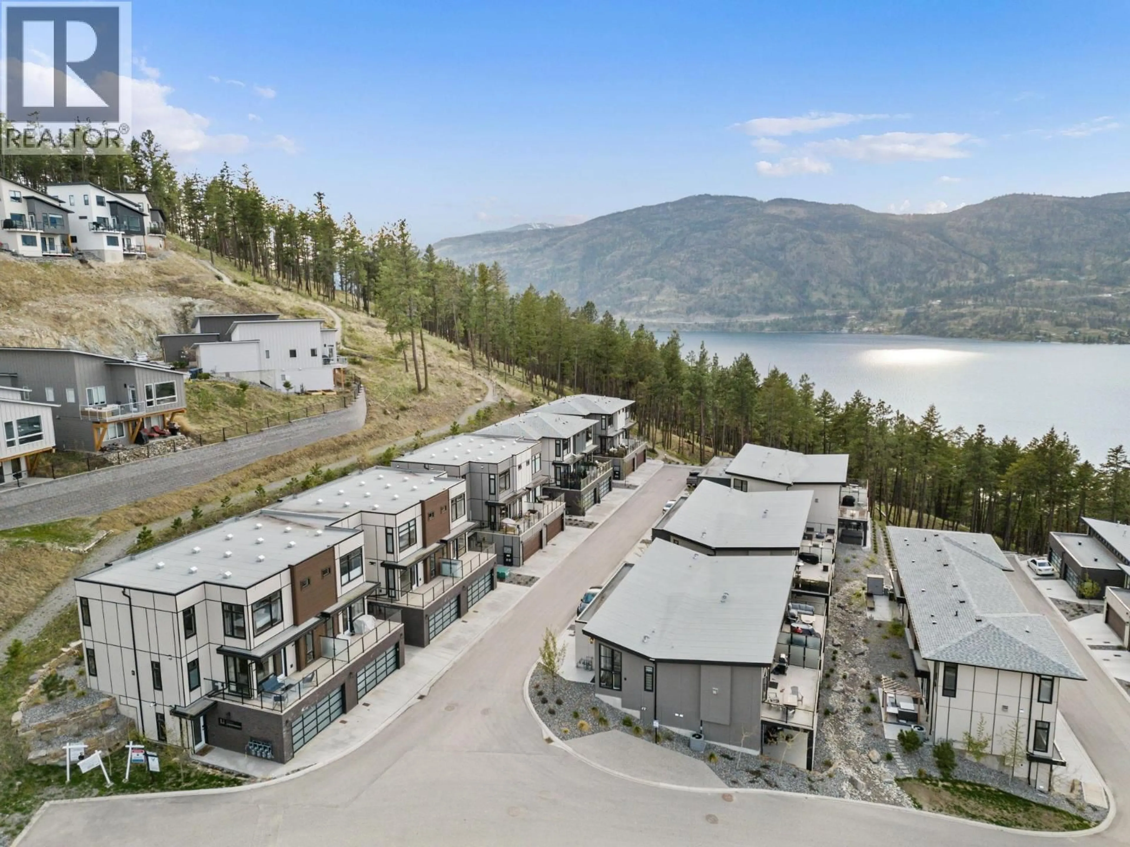 A pic from outside/outdoor area/front of a property/back of a property/a pic from drone, water/lake/river/ocean view for 7 - 3220 HILLTOWN DRIVE, Kelowna British Columbia V1V0C6