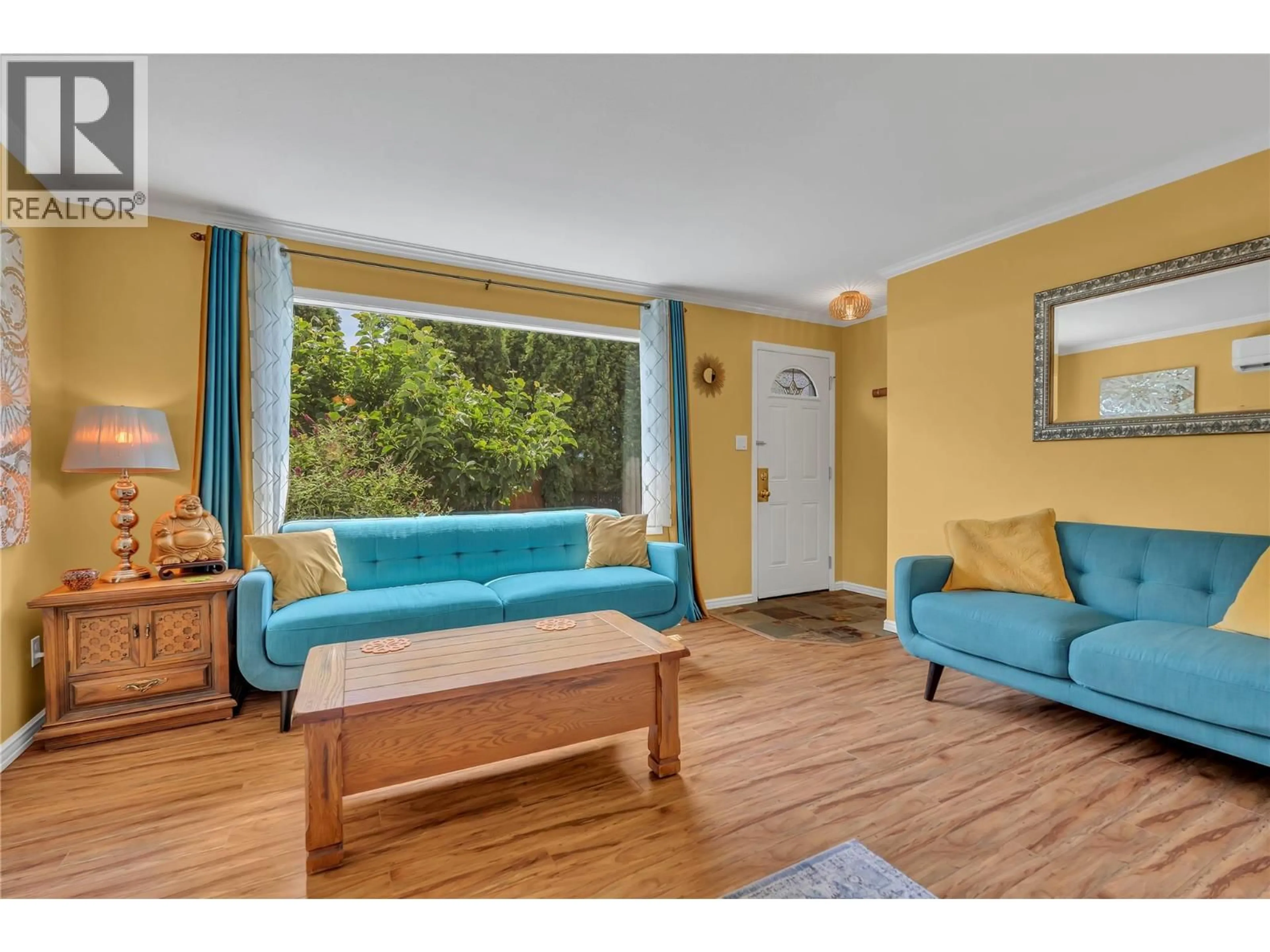 Living room with furniture, wood/laminate floor for 141 GRANBY AVENUE, Penticton British Columbia V2A2Y9