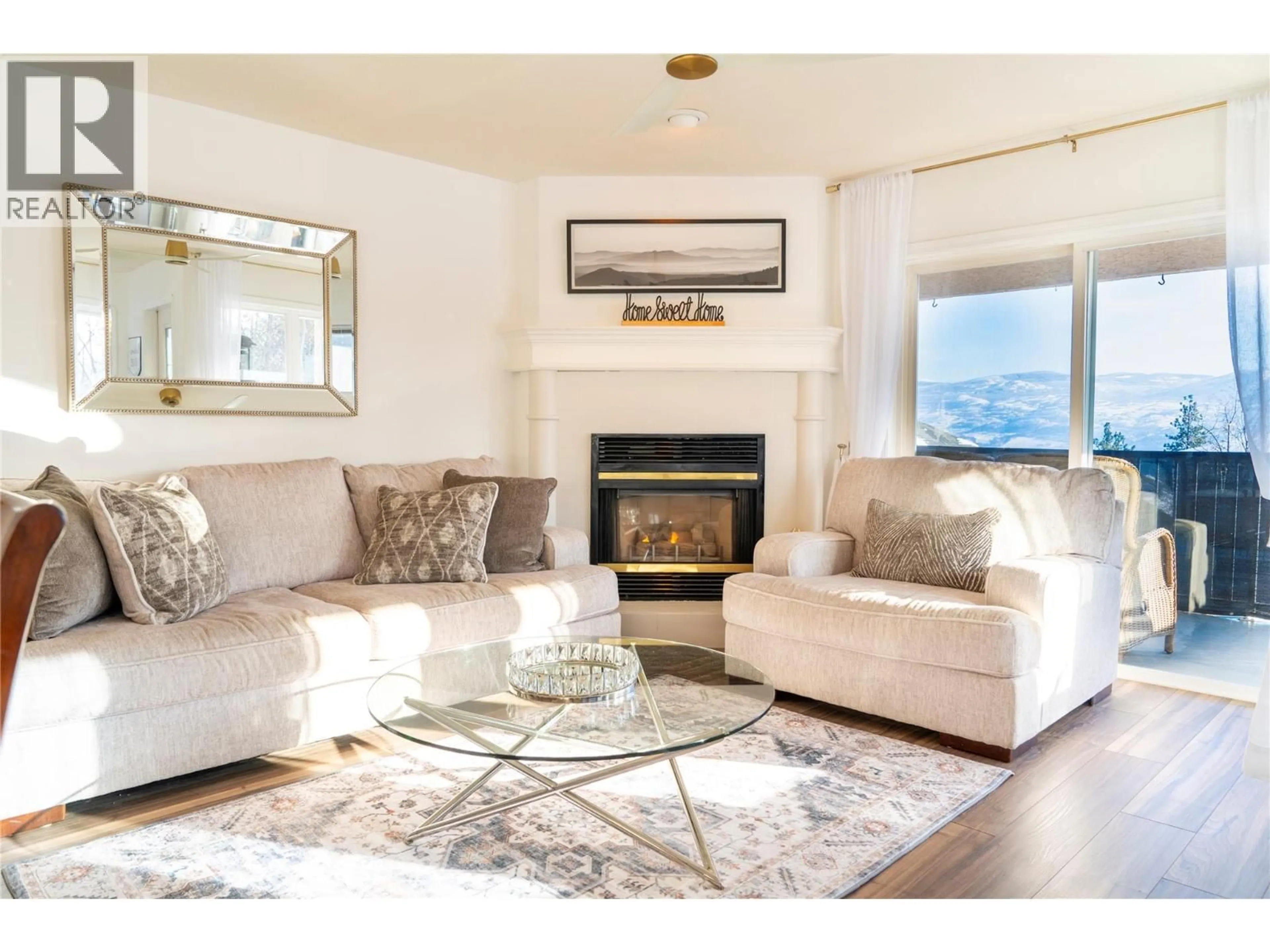 Living room with furniture, wood/laminate floor for 2669 WILD HORSE DRIVE, West Kelowna British Columbia V4T2K8
