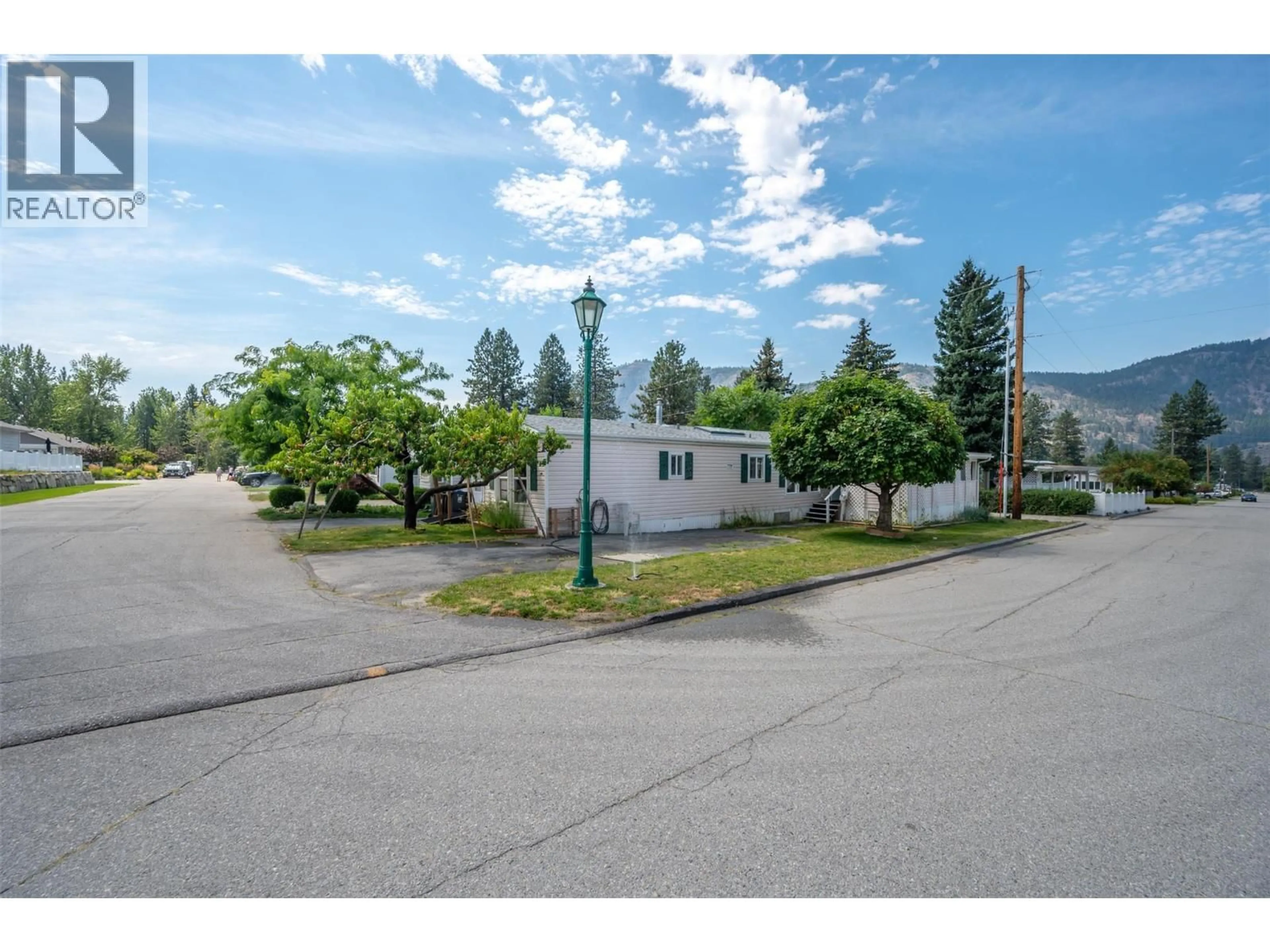 A pic from outside/outdoor area/front of a property/back of a property/a pic from drone, street for F22 - 4505 MCLEAN CREEK ROAD, Okanagan Falls British Columbia V0H1R1