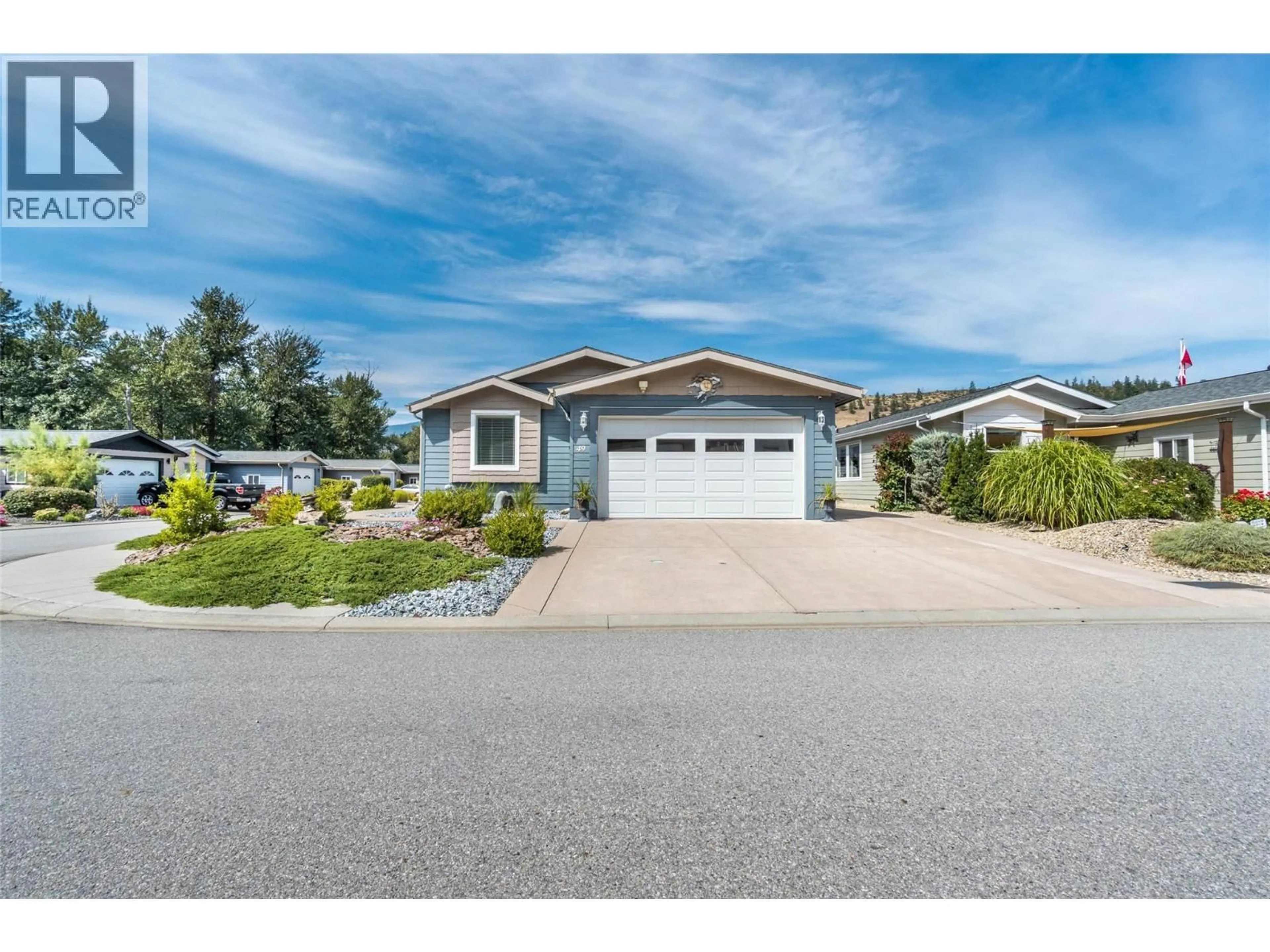 Home with vinyl exterior material, street for 49 - 8300 GALLAGHER LAKE FRONTAGE ROAD, Oliver British Columbia V0H1T2