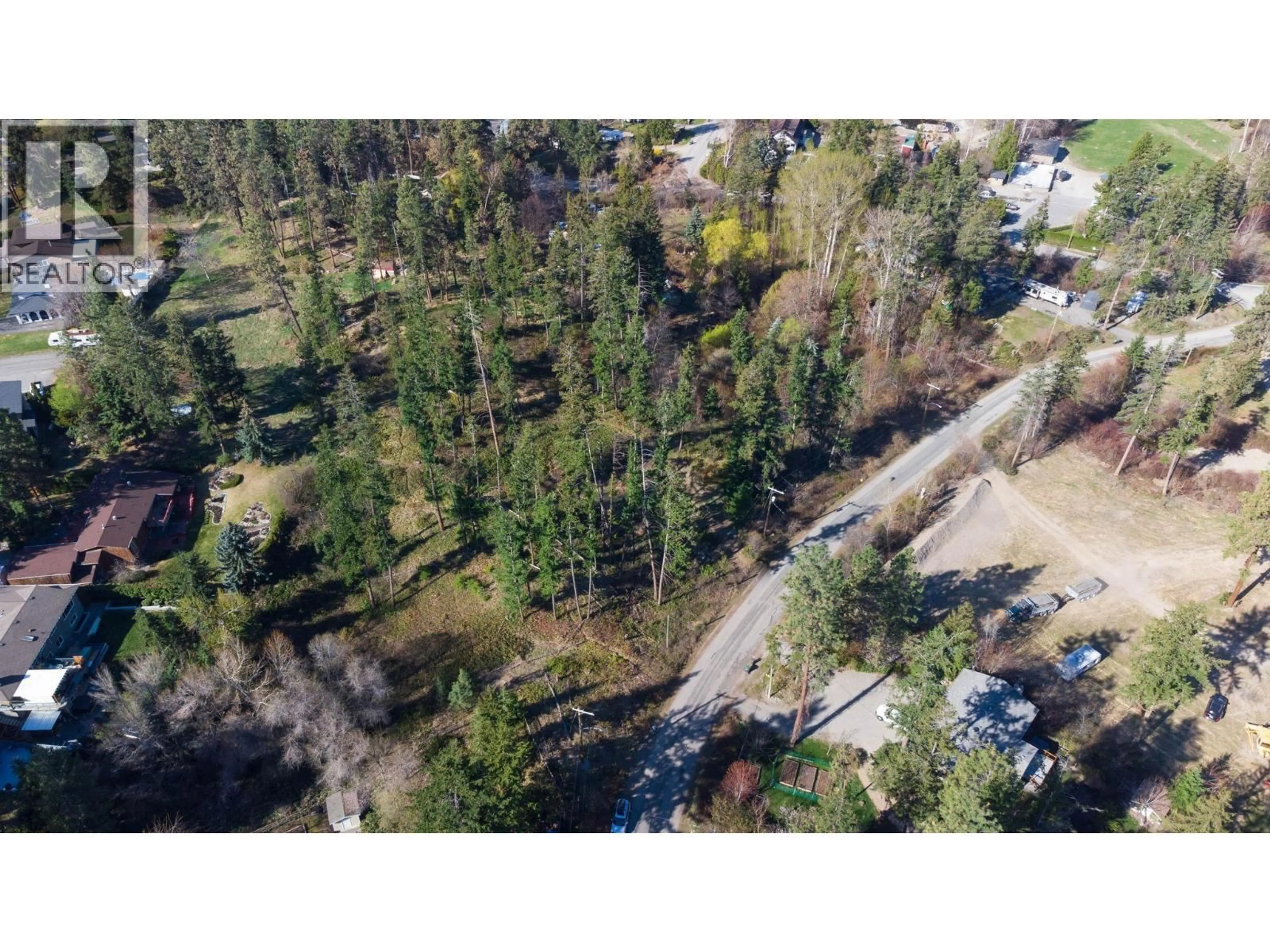 A pic from outside/outdoor area/front of a property/back of a property/a pic from drone, forest/trees view for 3281 HALL ROAD, Kelowna British Columbia V1W2V1