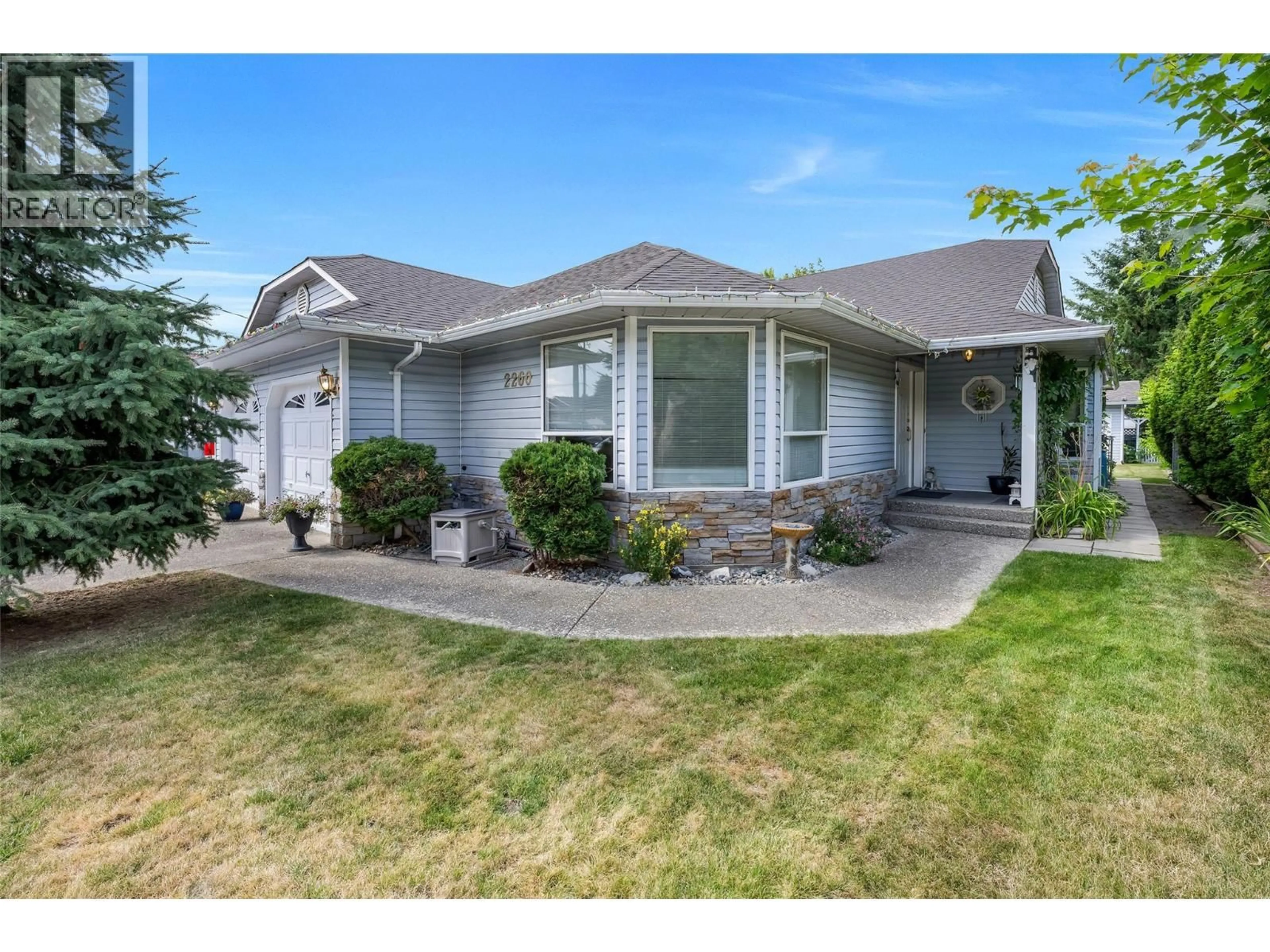 Home with vinyl exterior material, street for 2260 WILSON AVENUE, Armstrong British Columbia V0E1B1