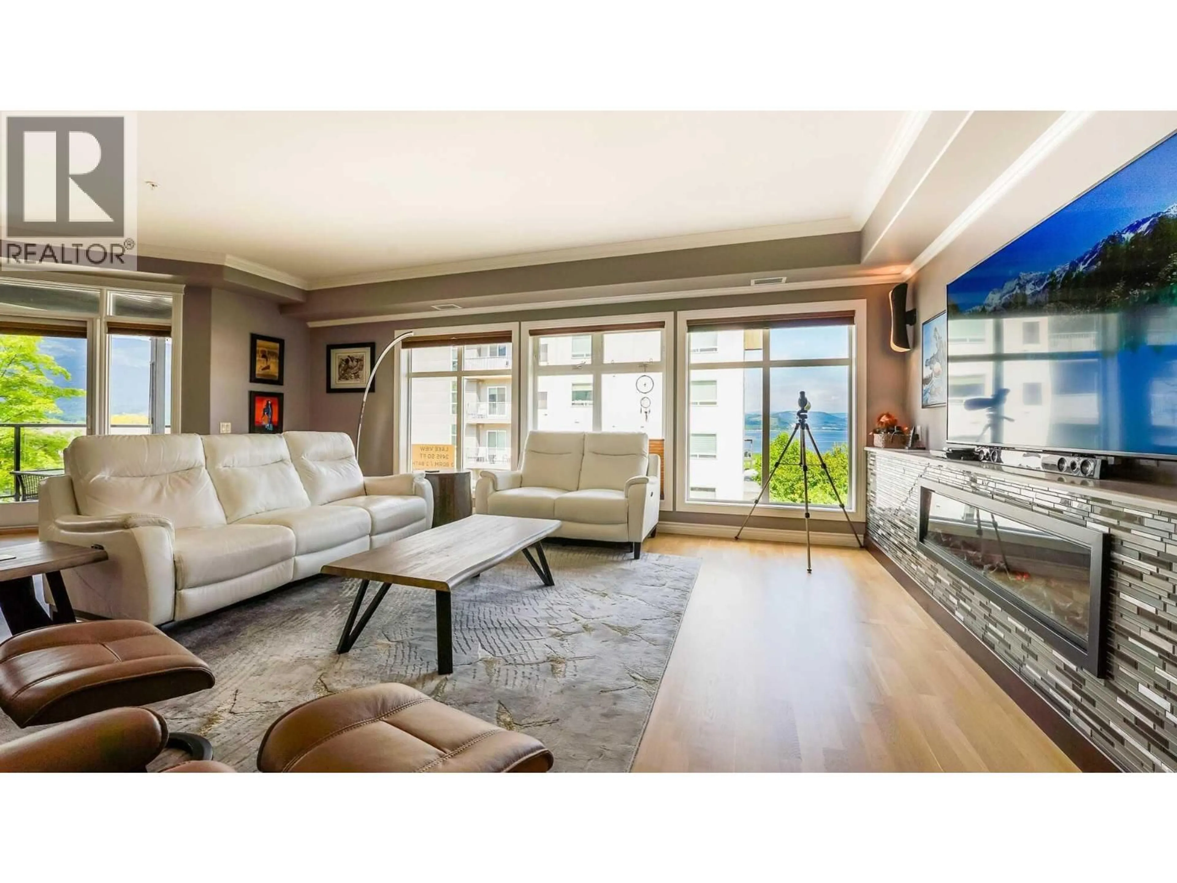 Living room with furniture, wood/laminate floor for 302 - 160 HARBOURFRONT DRIVE, Salmon Arm British Columbia V1E3M3