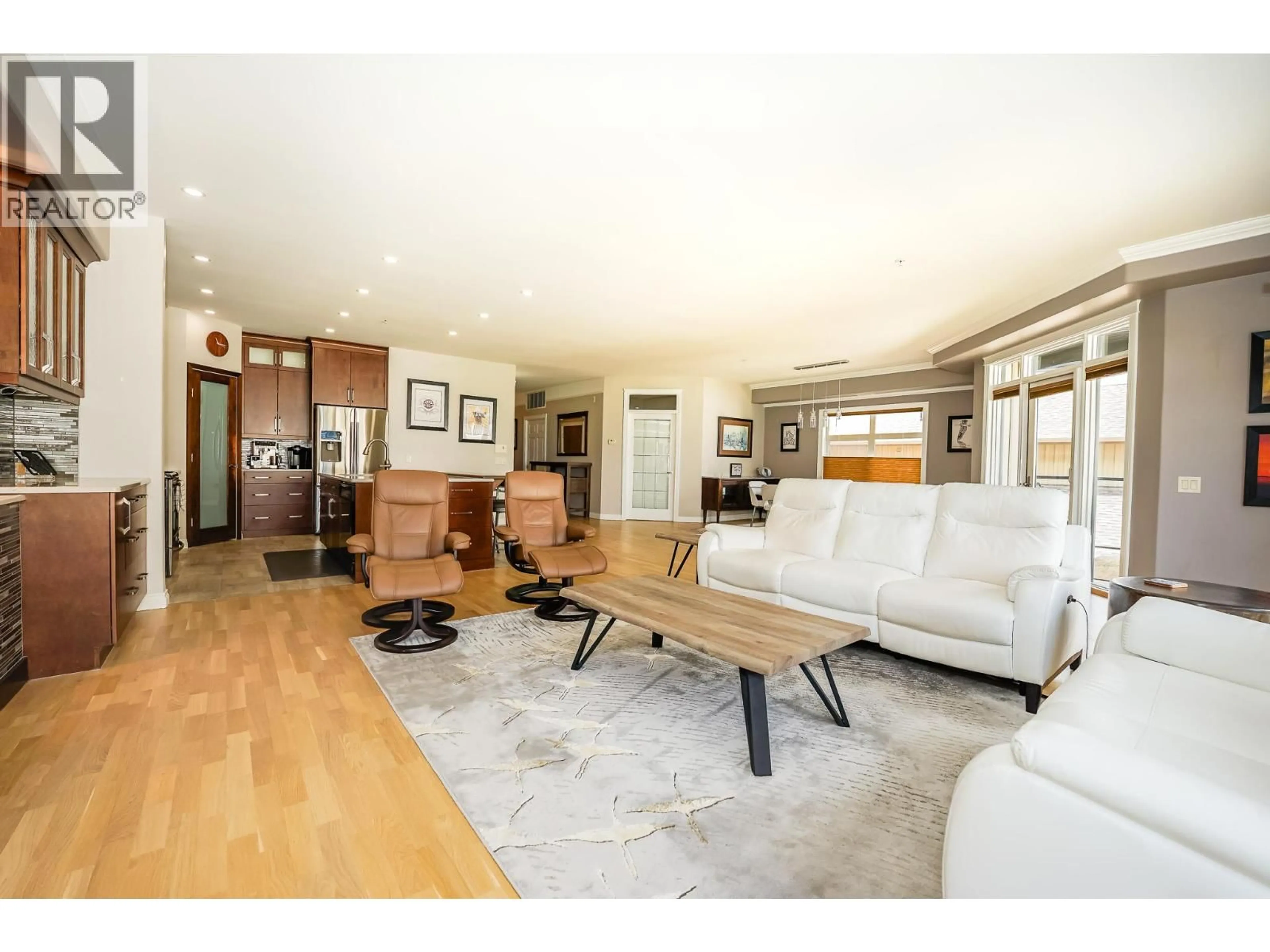 Living room with furniture, wood/laminate floor for 302 - 160 HARBOURFRONT DRIVE, Salmon Arm British Columbia V1E3M3