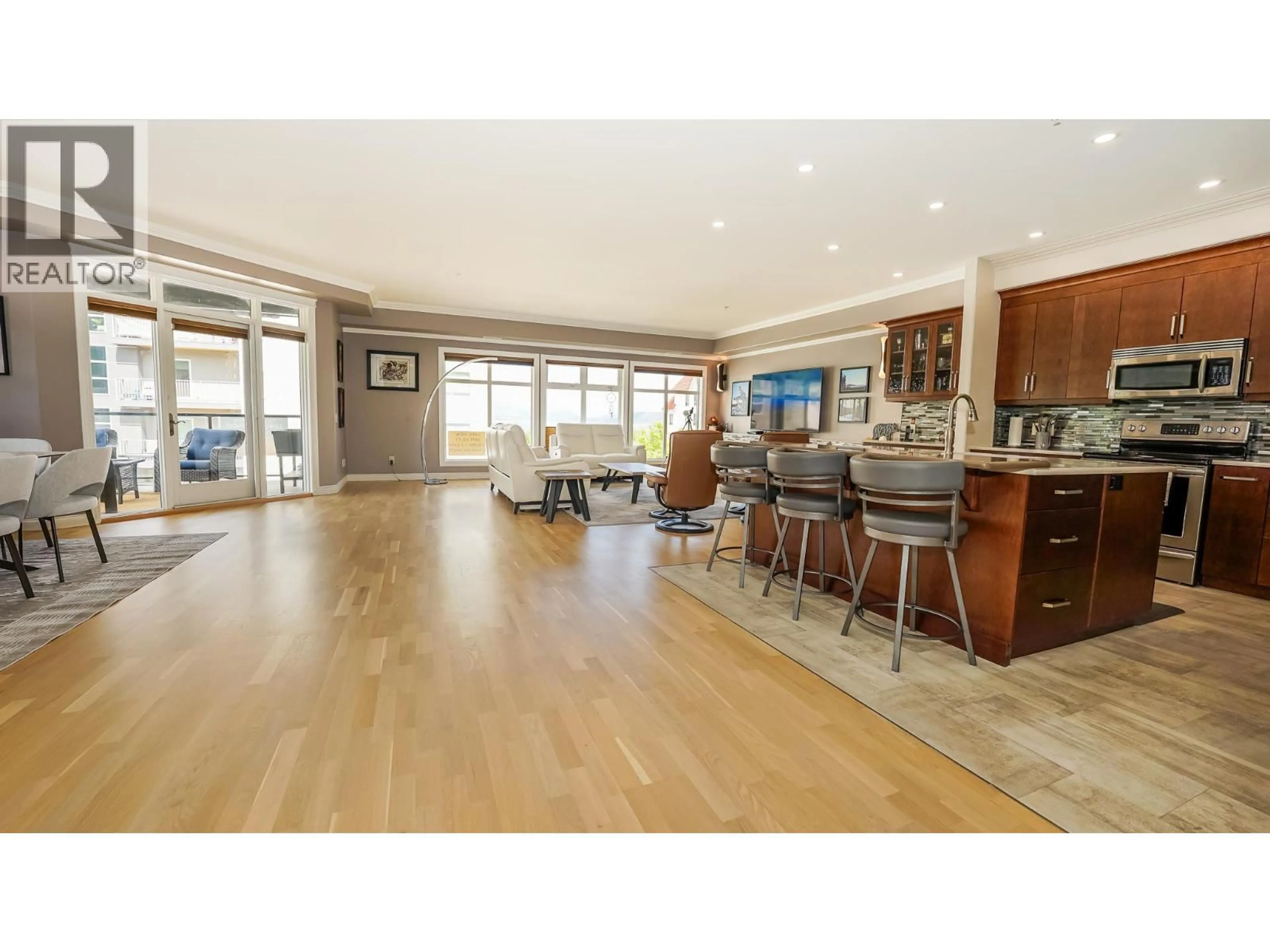 Open concept kitchen, wood/laminate floor for 302 - 160 HARBOURFRONT DRIVE, Salmon Arm British Columbia V1E3M3