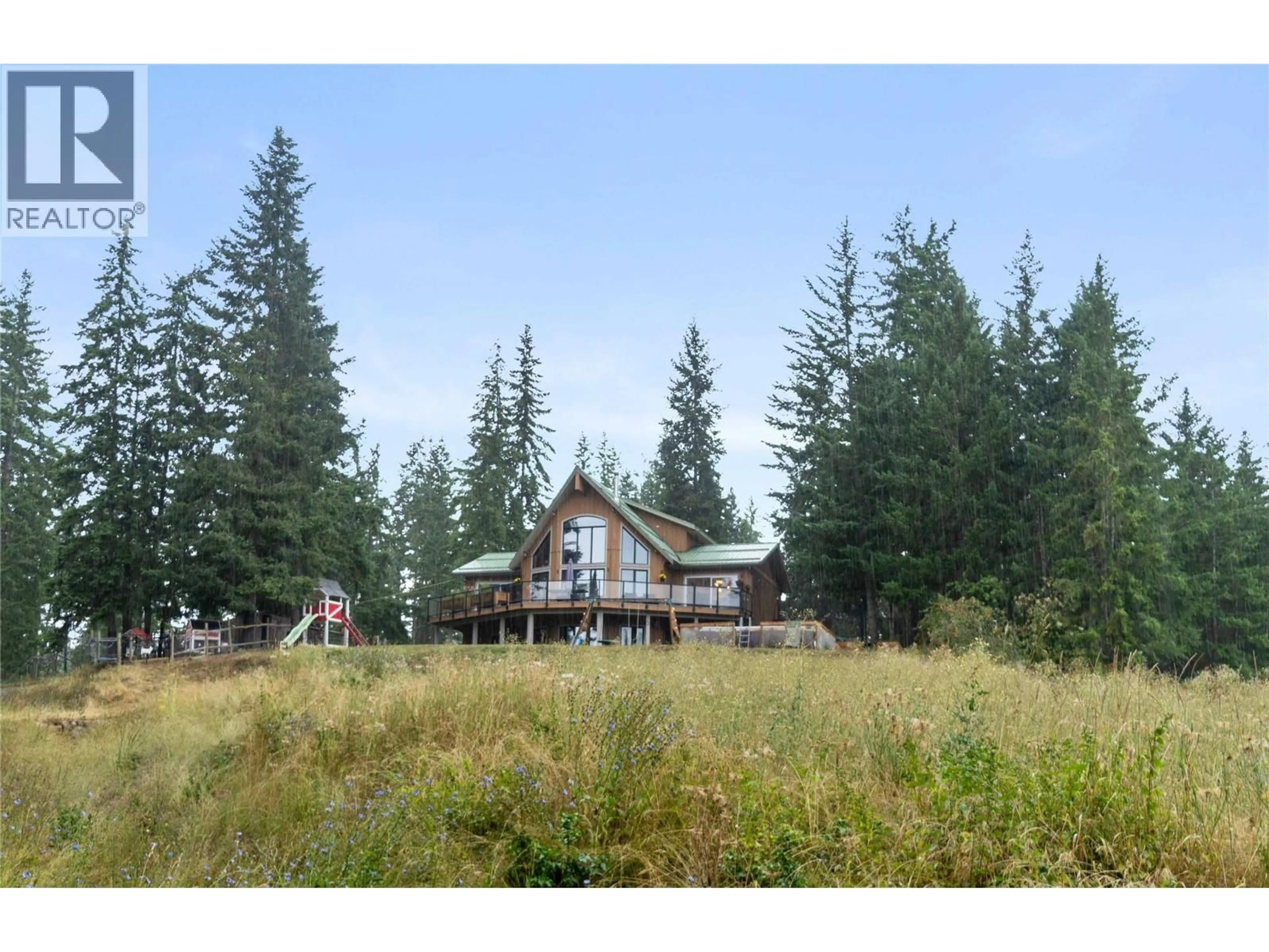 A pic from outside/outdoor area/front of a property/back of a property/a pic from drone, mountain view for 65 FURLONG ROAD, Enderby British Columbia V0E1V3