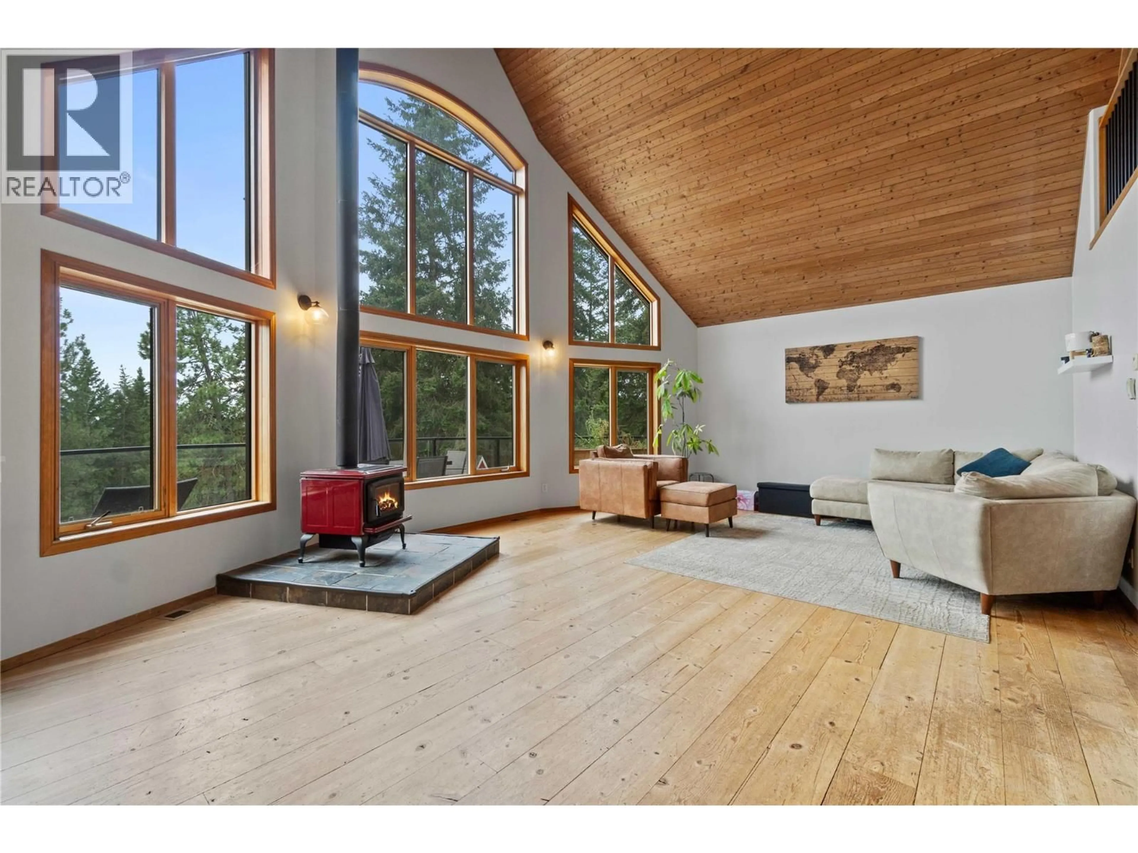 Living room with furniture, wood/laminate floor for 65 FURLONG ROAD, Enderby British Columbia V0E1V3