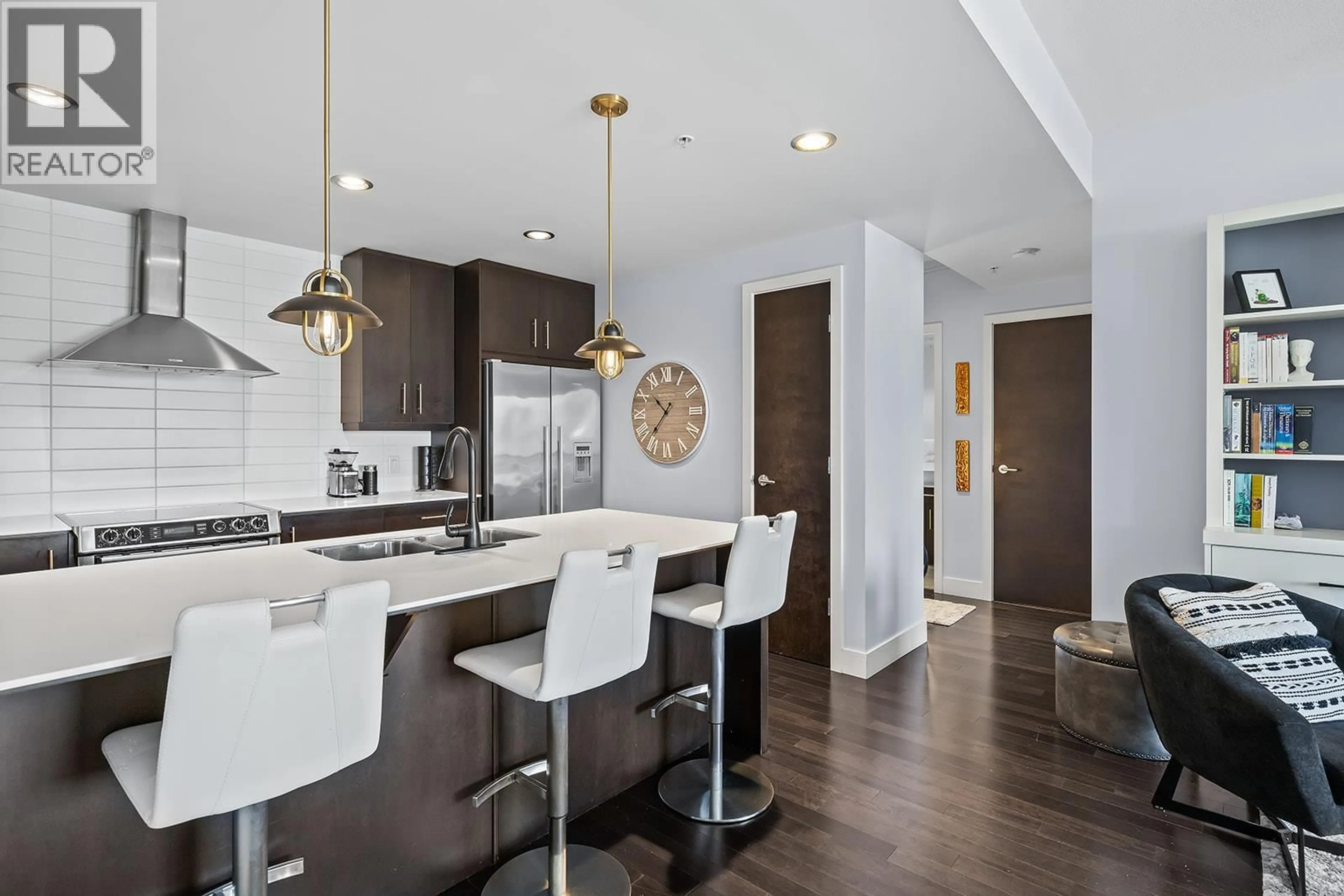Open concept kitchen, wood/laminate floor for 1208 - 2040 SPRINGFIELD ROAD, Kelowna British Columbia V1Y9N7
