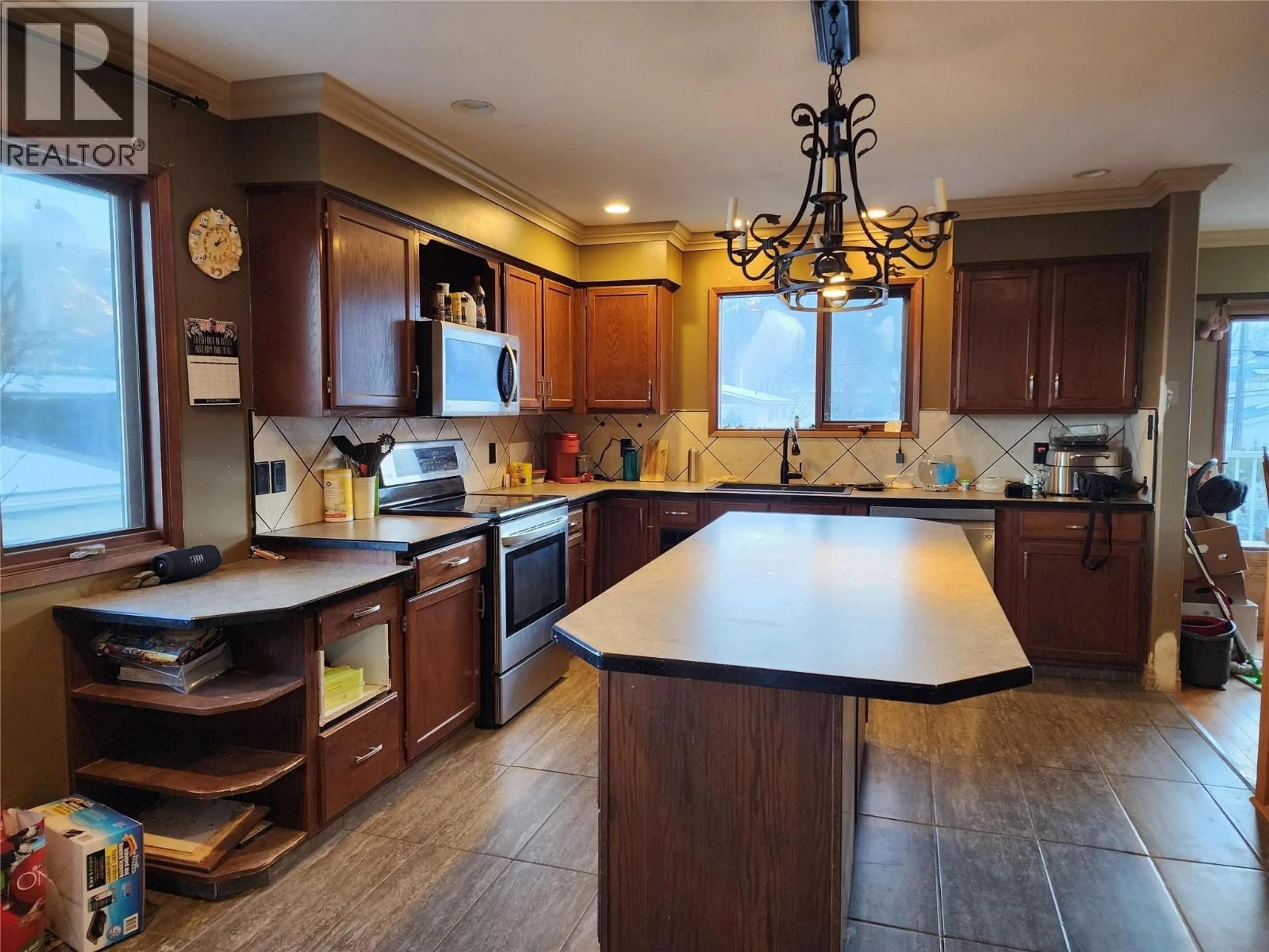Open concept kitchen, ceramic/tile floor for 1408 SPRUCE AVENUE, Merritt British Columbia V1K1L2
