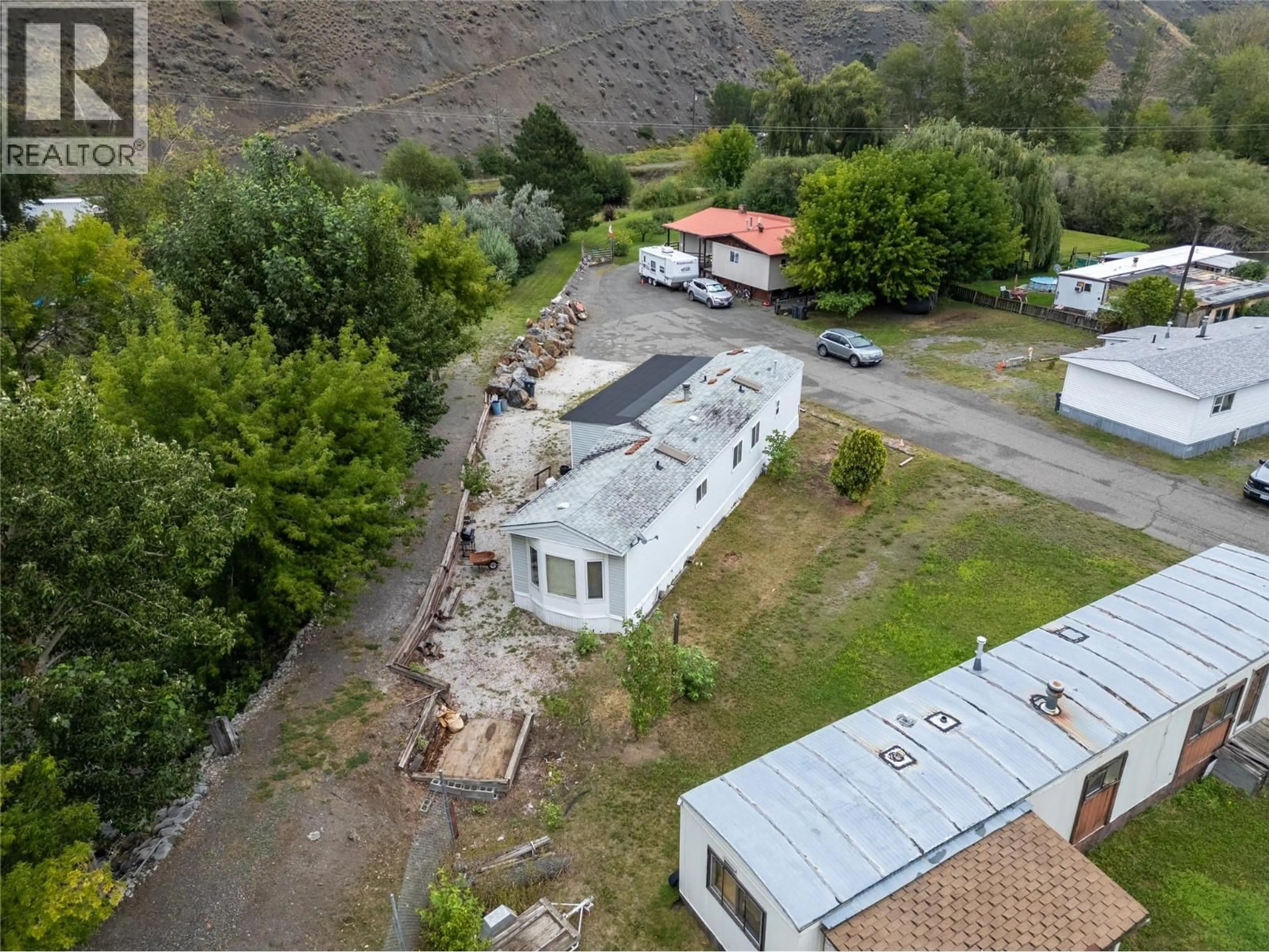 A pic from outside/outdoor area/front of a property/back of a property/a pic from drone, mountain view for 71 - 701 TRANS CANADA HIGHWAY, Cache Creek British Columbia V0K1H0