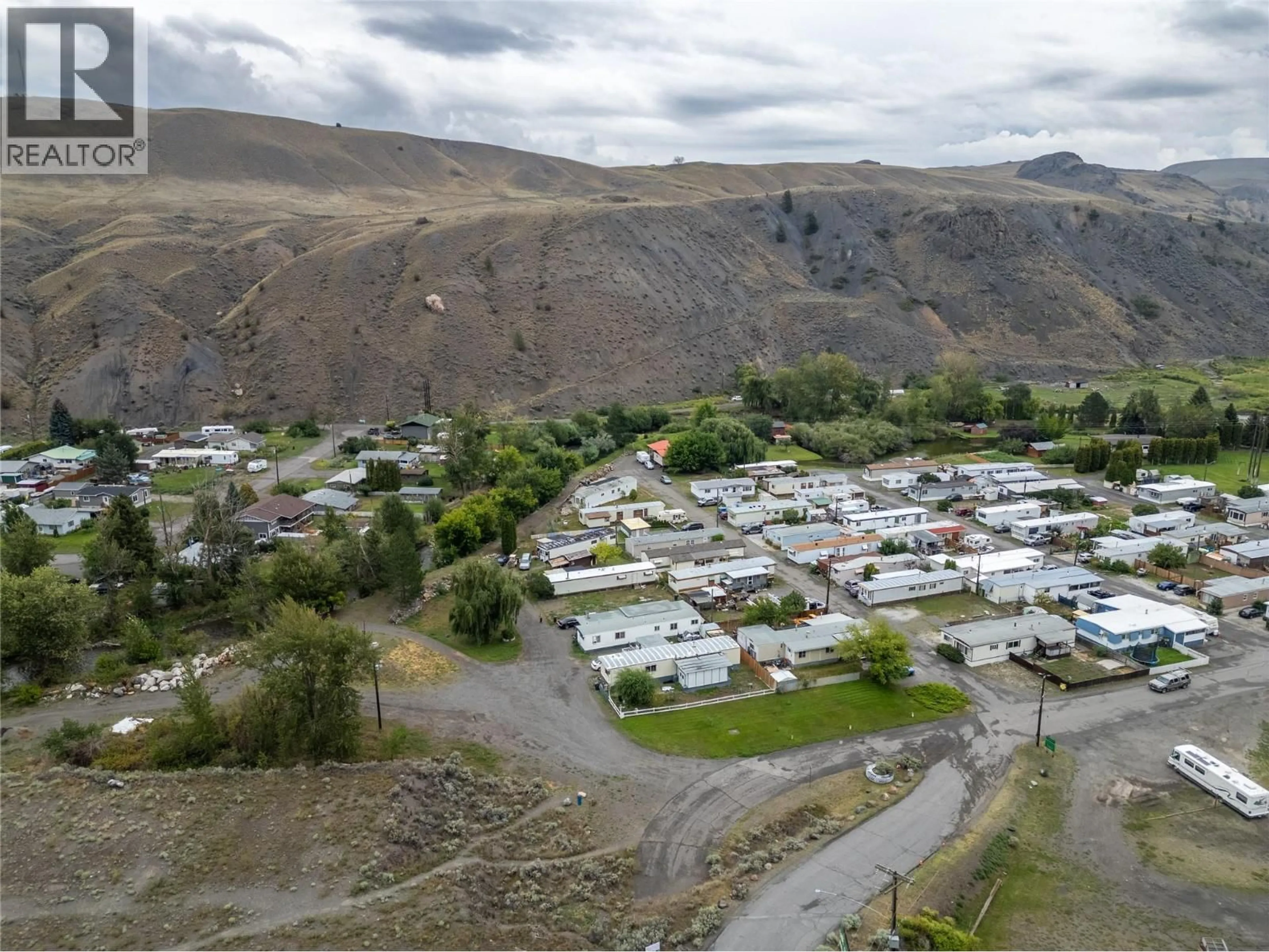 A pic from outside/outdoor area/front of a property/back of a property/a pic from drone, mountain view for 71 - 701 TRANS CANADA HIGHWAY, Cache Creek British Columbia V0K1H0