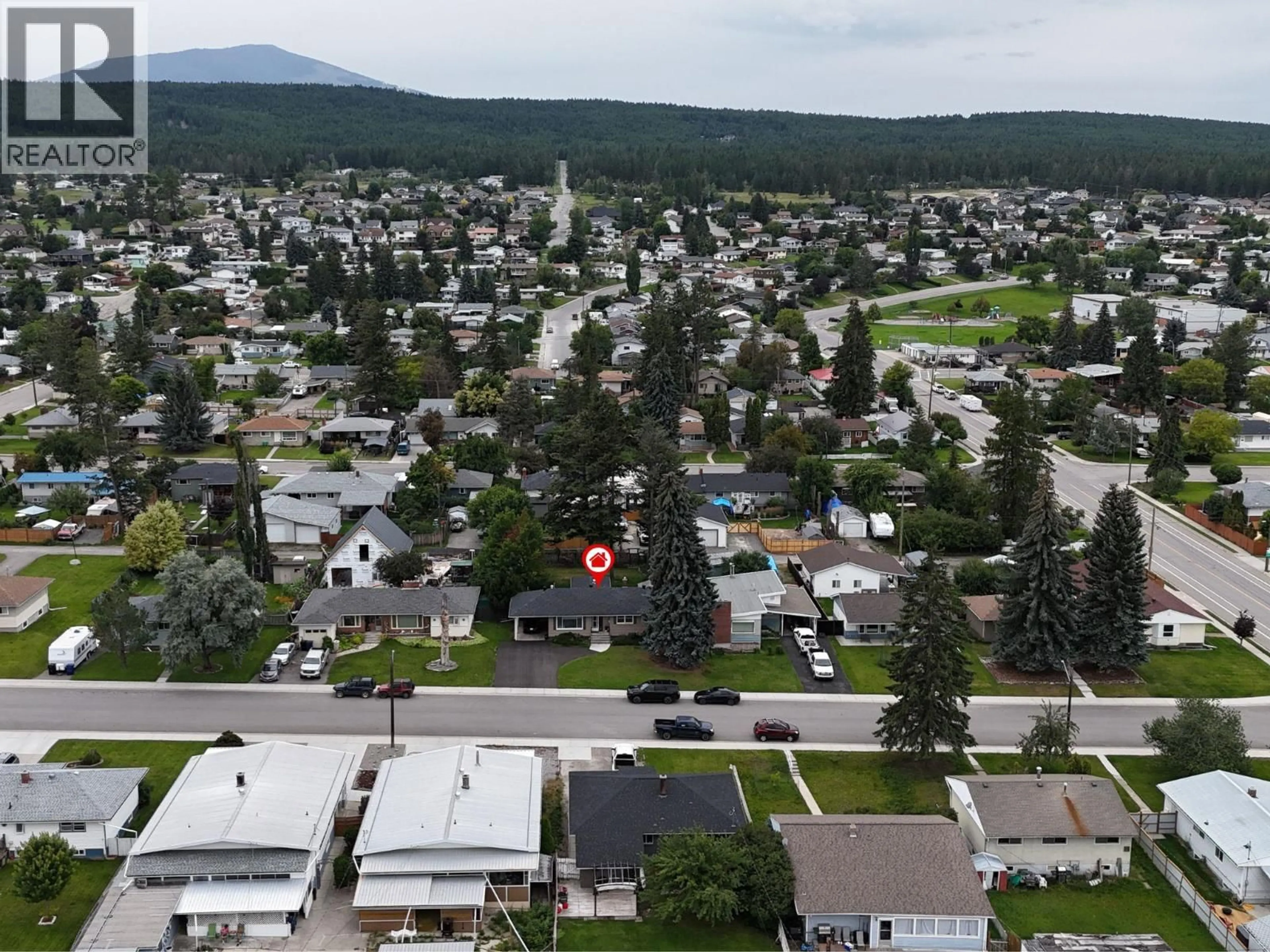 A pic from outside/outdoor area/front of a property/back of a property/a pic from drone, mountain view for 709 9TH STREET SOUTH, Cranbrook British Columbia V1C1R6