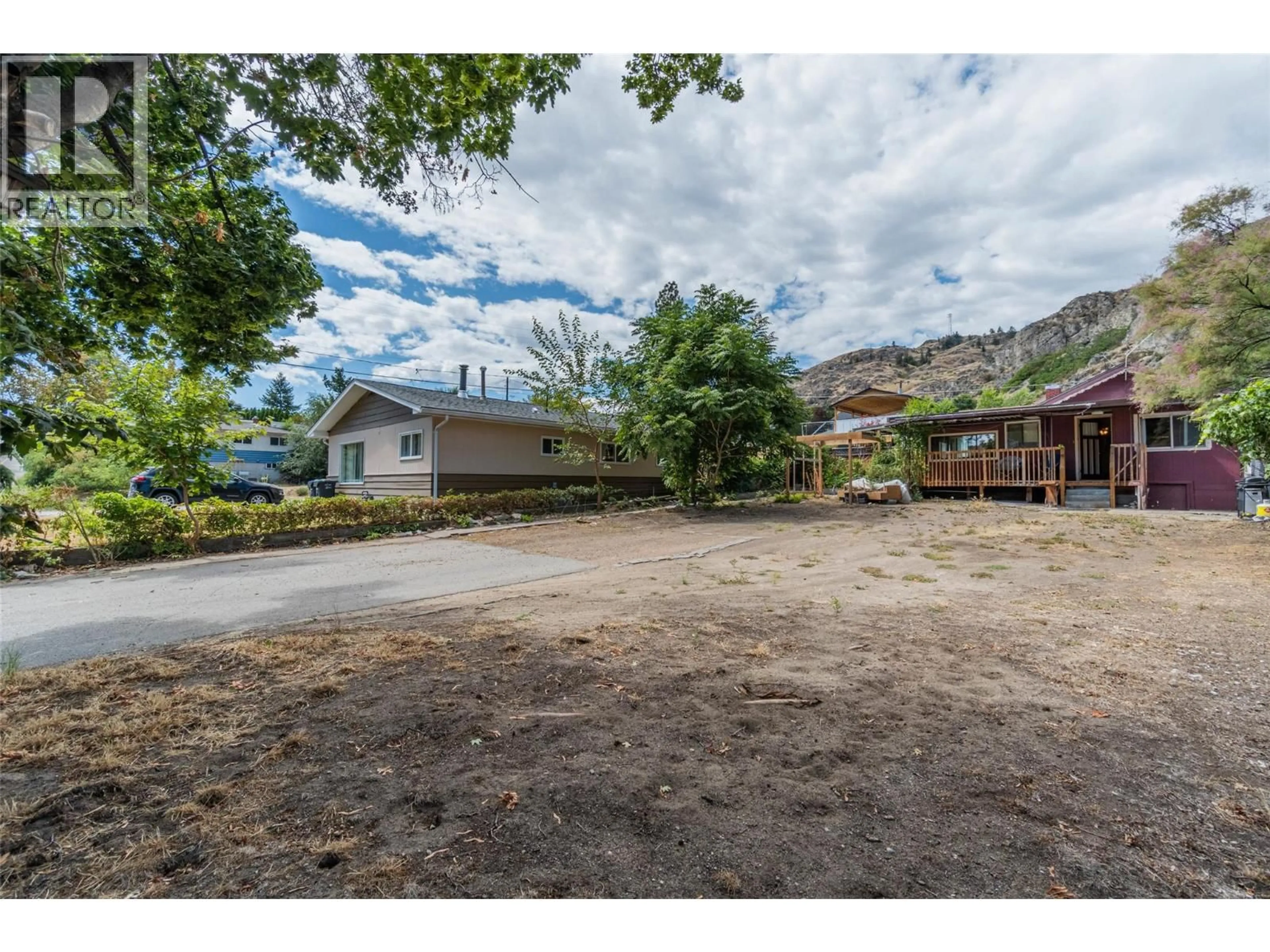 A pic from outside/outdoor area/front of a property/back of a property/a pic from drone, mountain view for 6514 HOLLOW STREET, Oliver British Columbia V0H1T0