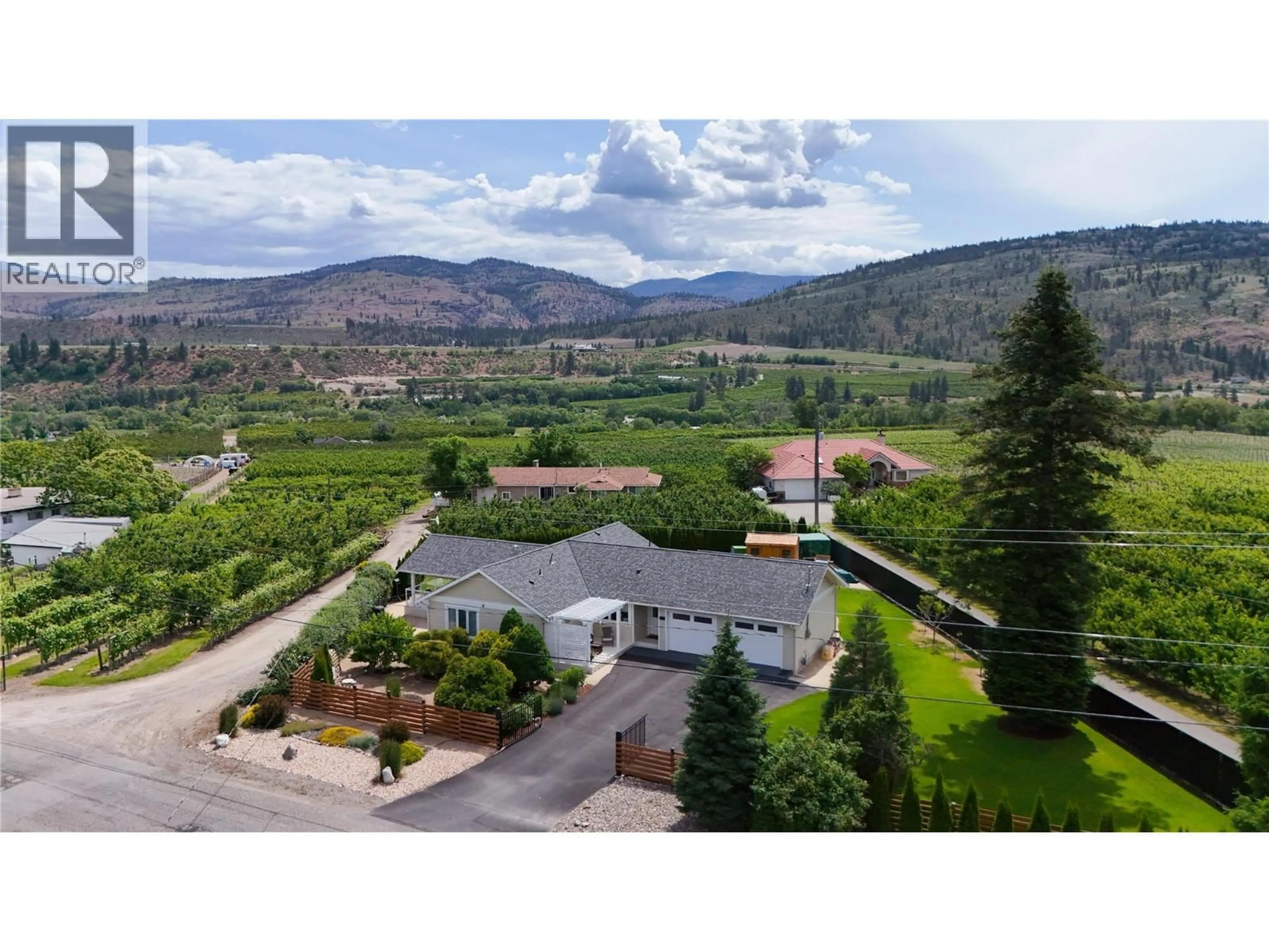 A pic from outside/outdoor area/front of a property/back of a property/a pic from drone, mountain view for 5609 YARROW STREET, Oliver British Columbia V0H1T9