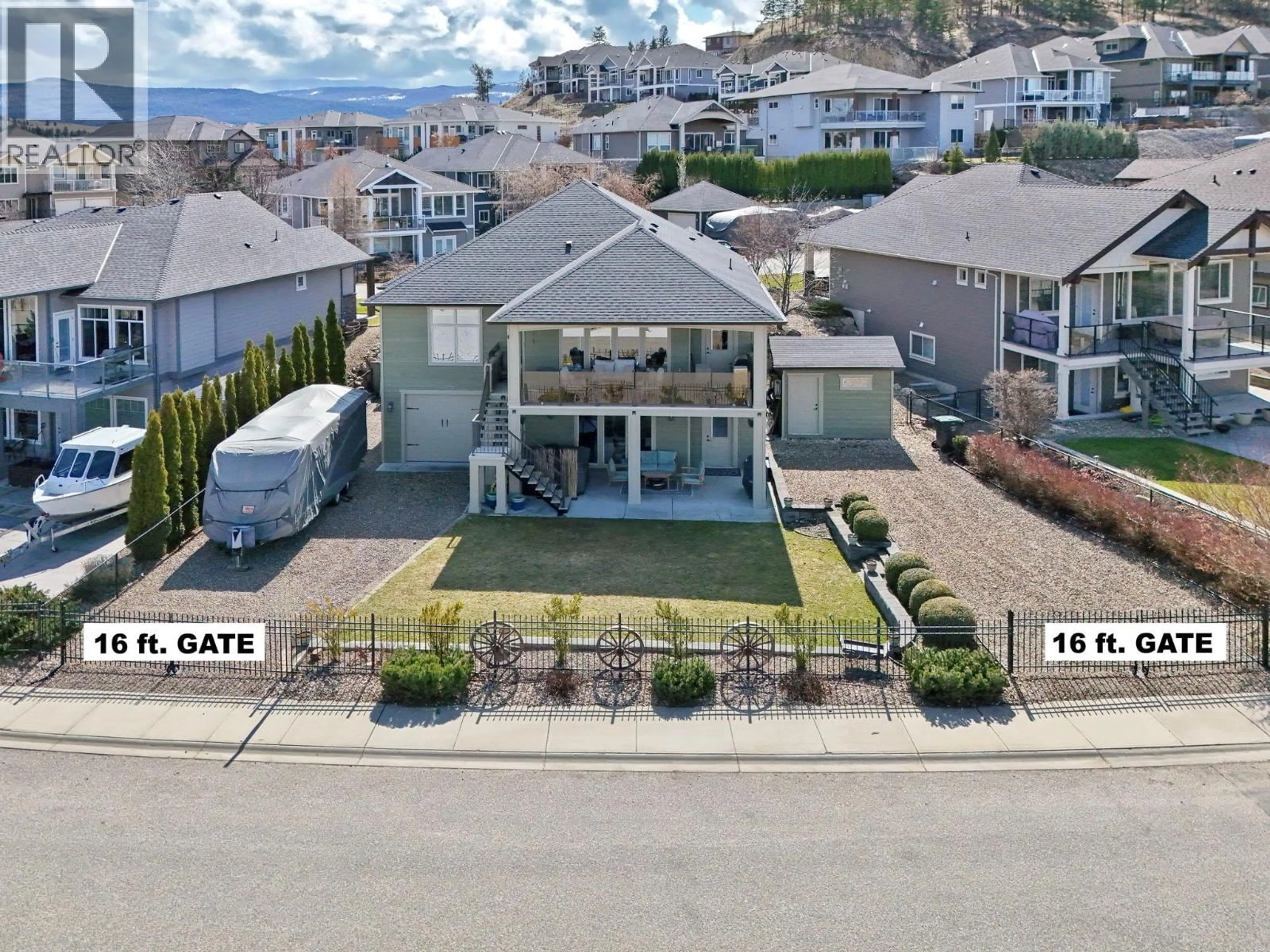 A pic from outside/outdoor area/front of a property/back of a property/a pic from drone, street for 338 PRESTWICK LANE, Kelowna British Columbia V1P1R7
