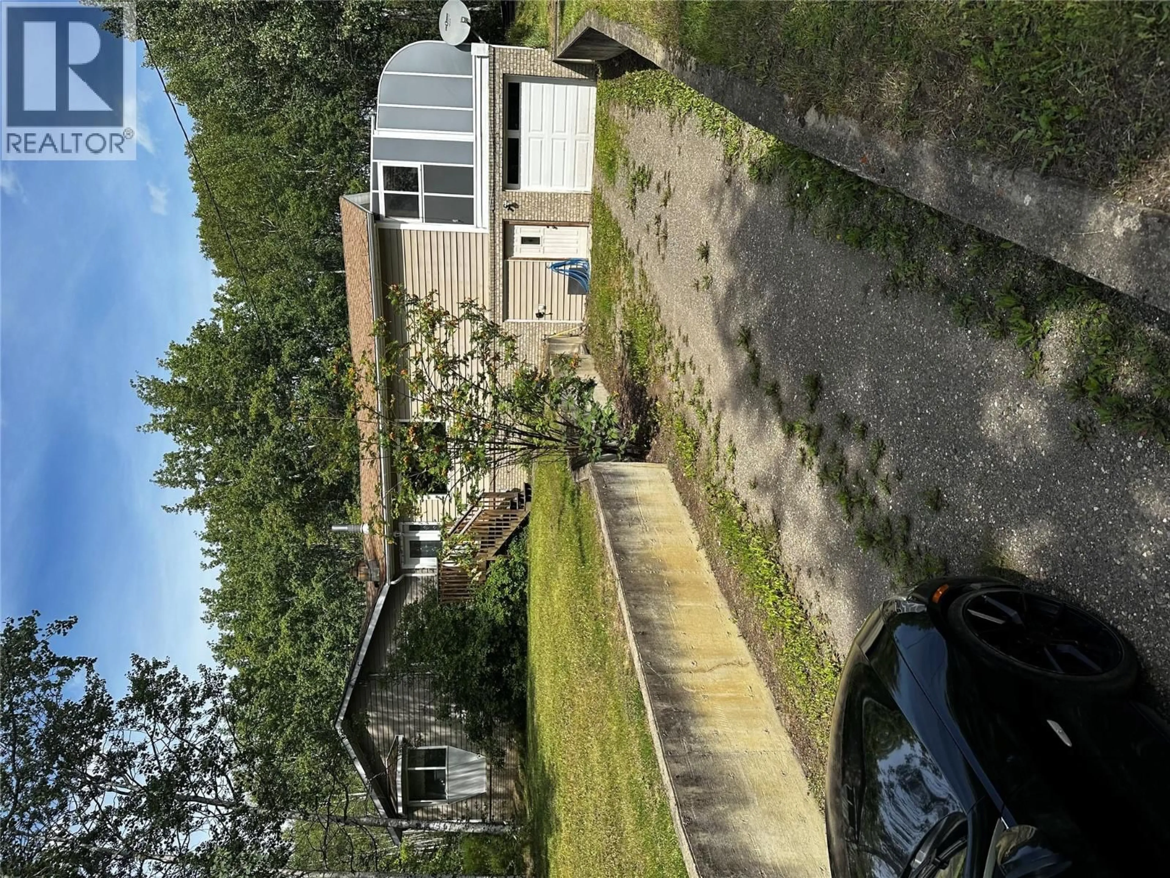 A pic from outside/outdoor area/front of a property/back of a property/a pic from drone, street for 6708 DOKKIE OTHER, Chetwynd British Columbia V0C1J0