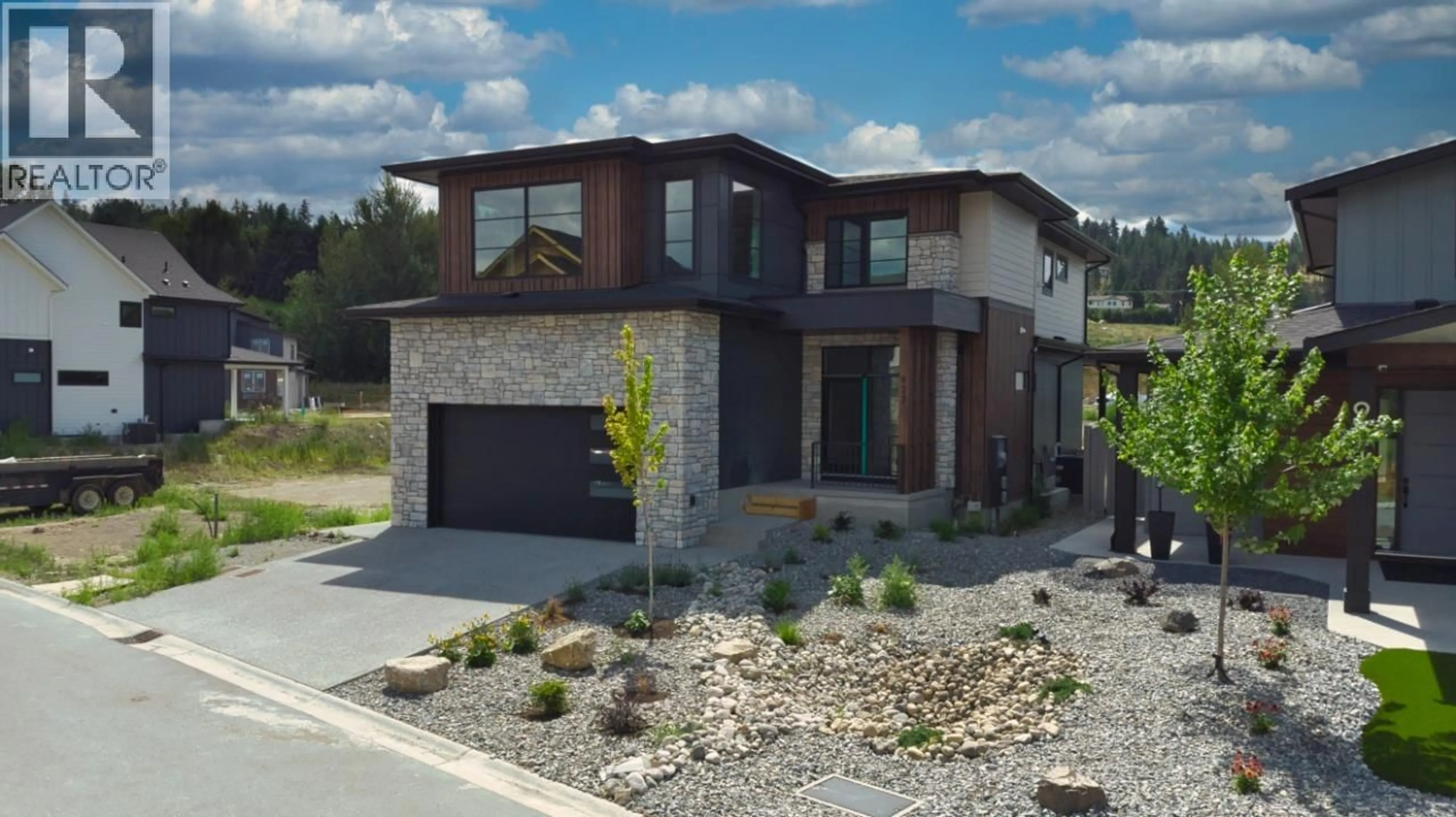 Home with brick exterior material, street for 925 BULL CRESCENT, Kelowna British Columbia V1W0E6