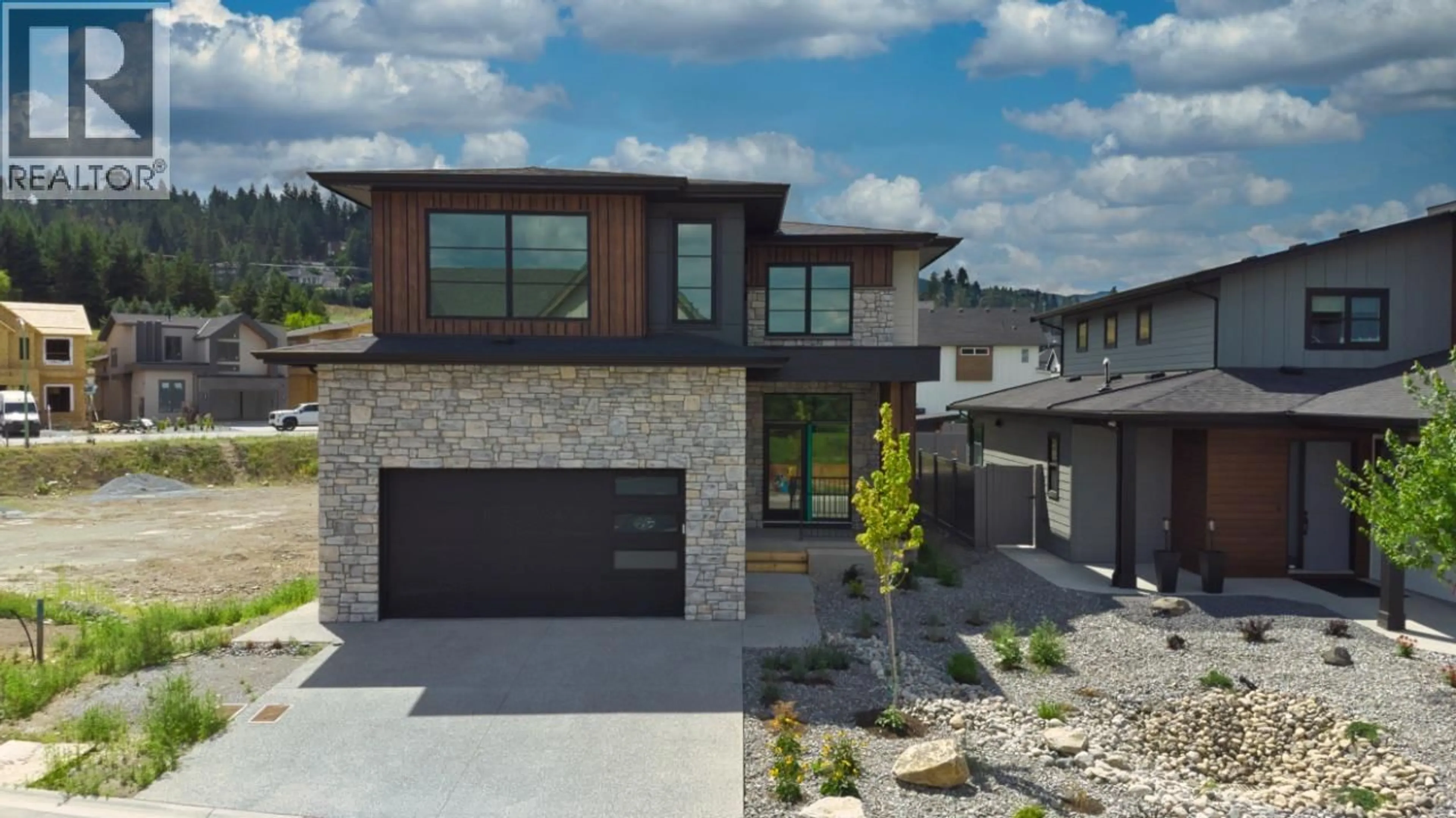 Home with brick exterior material, street for 925 BULL CRESCENT, Kelowna British Columbia V1W0E6