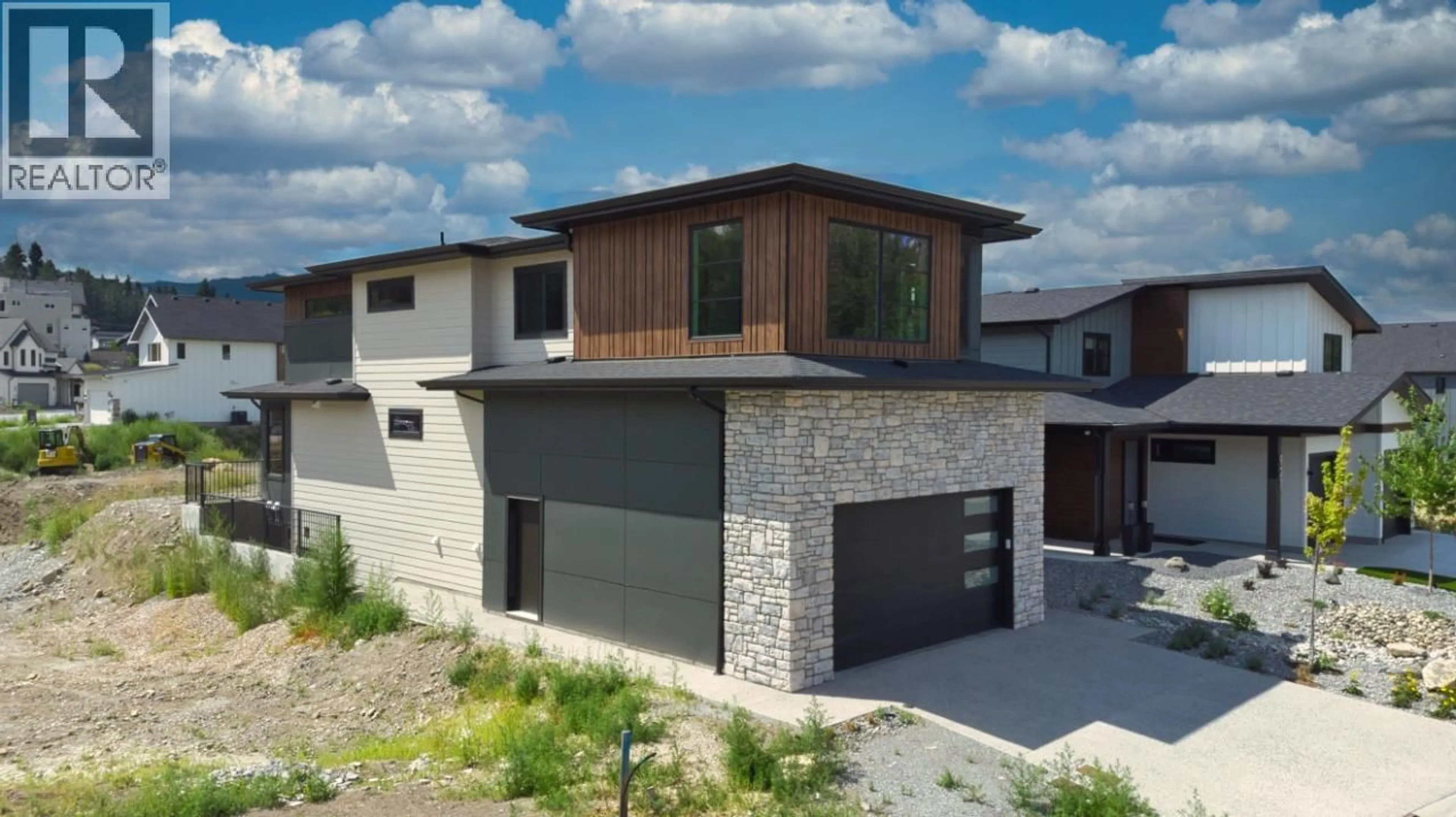 Home with brick exterior material, street for 925 BULL CRESCENT, Kelowna British Columbia V1W0E6