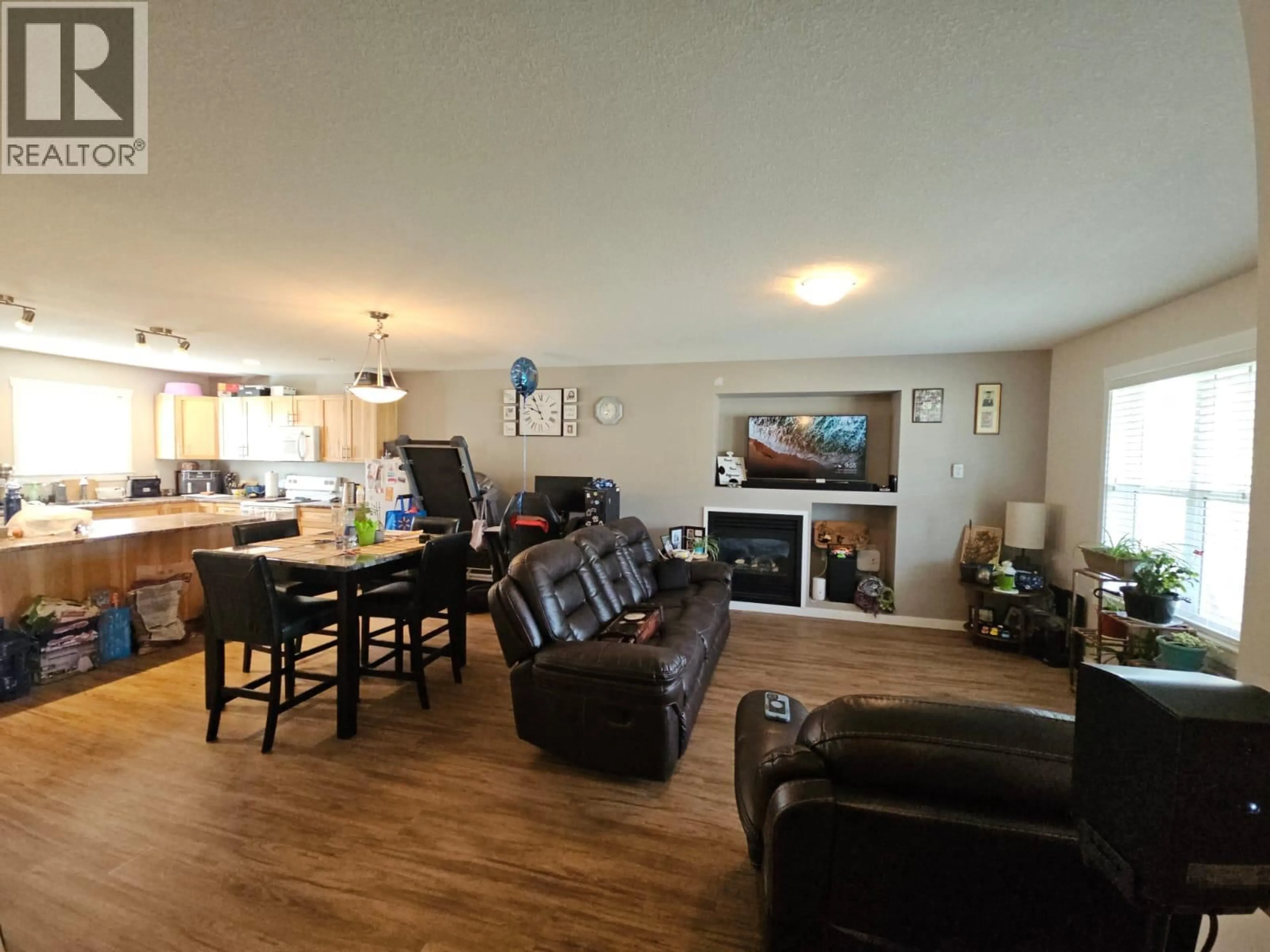 Living room with furniture, wood/laminate floor for 5214 41 STREET NORTHEAST, Chetwynd British Columbia V0C1J0
