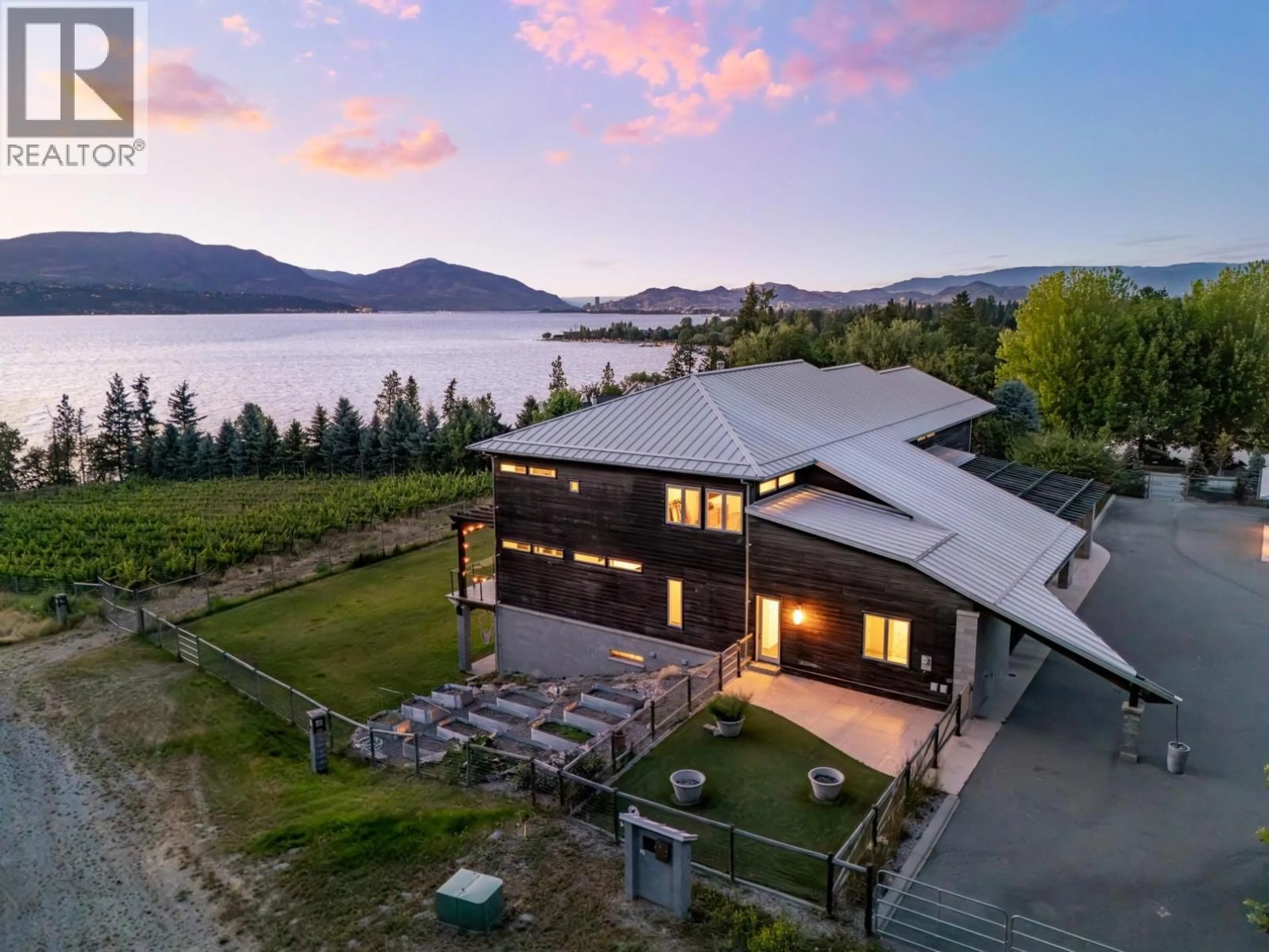 A pic from outside/outdoor area/front of a property/back of a property/a pic from drone, water/lake/river/ocean view for 4840 LAKESHORE ROAD, Kelowna British Columbia V1W4H6