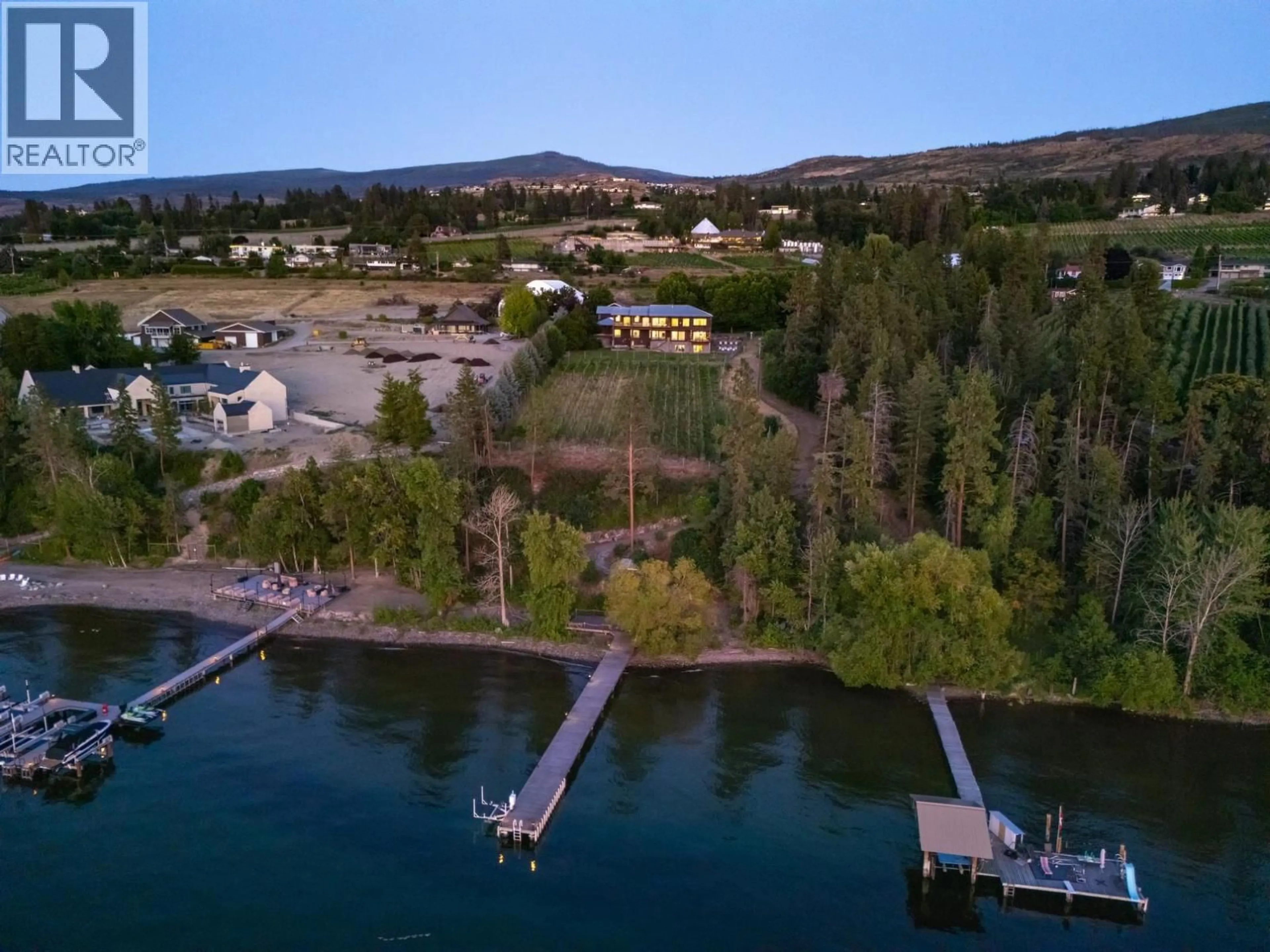 A pic from outside/outdoor area/front of a property/back of a property/a pic from drone, water/lake/river/ocean view for 4840 LAKESHORE ROAD, Kelowna British Columbia V1W4H6