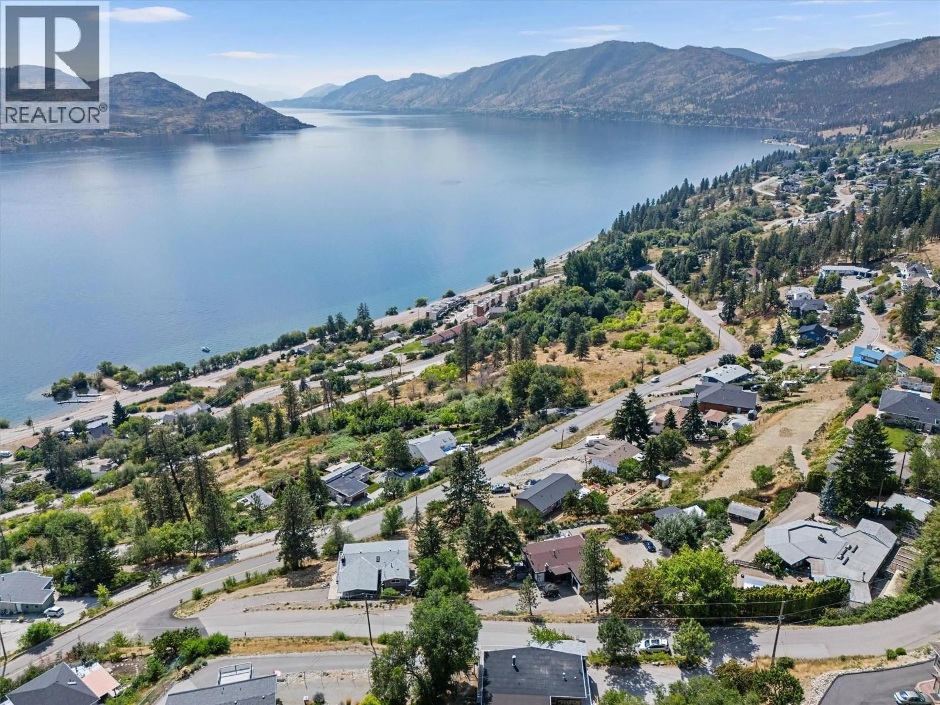 A pic from outside/outdoor area/front of a property/back of a property/a pic from drone, water/lake/river/ocean view for 5815 MACGREGOR ROAD, Peachland British Columbia V0H1X4