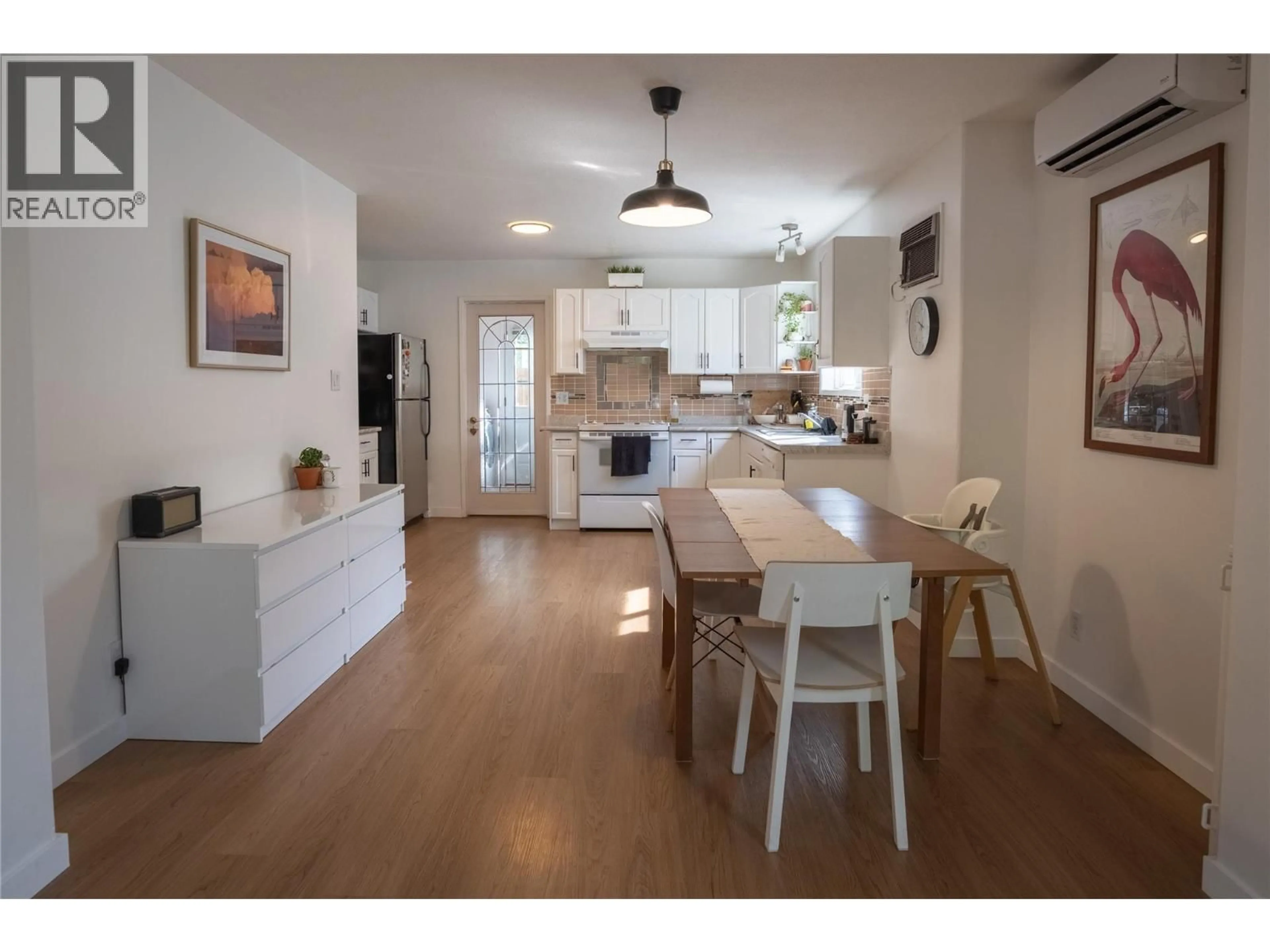 Open concept kitchen, wood/laminate floor for 102 - 532 PAPINEAU STREET, Penticton British Columbia V2A4X5