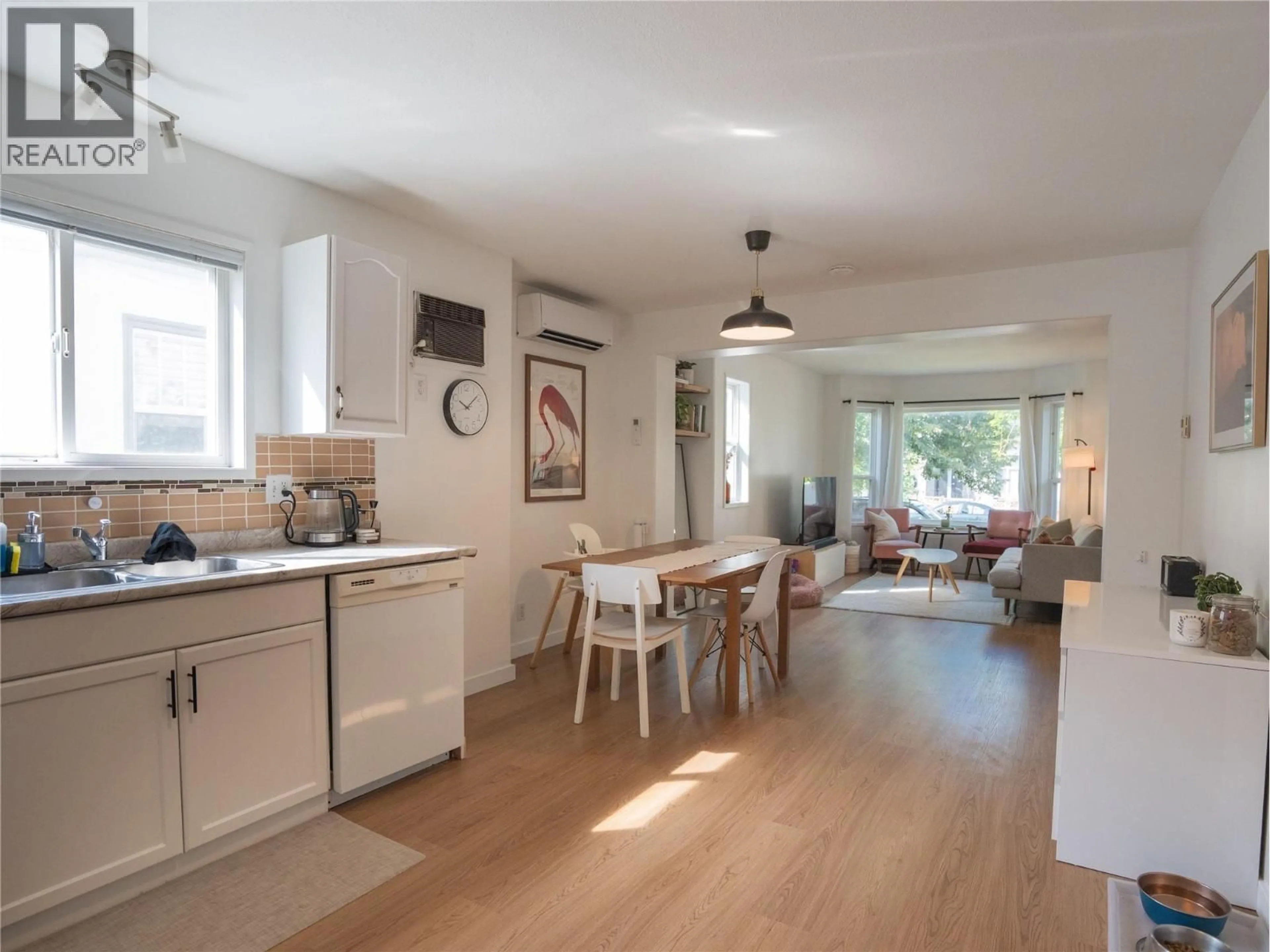 Open concept kitchen, wood/laminate floor for 102 - 532 PAPINEAU STREET, Penticton British Columbia V2A4X5