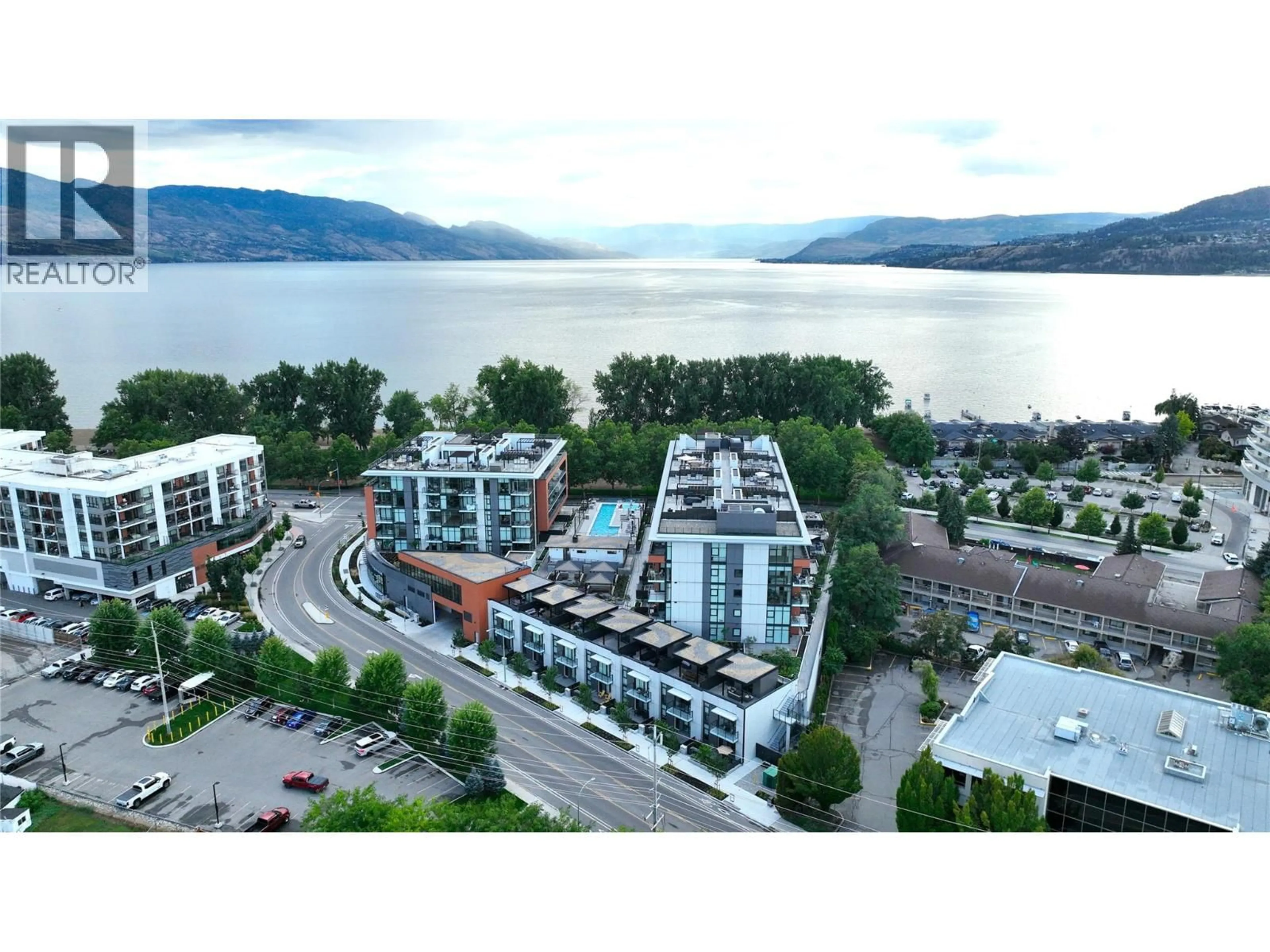 A pic from outside/outdoor area/front of a property/back of a property/a pic from drone, water/lake/river/ocean view for 305 - 3409 LAKESHORE ROAD, Kelowna British Columbia V1W0G6