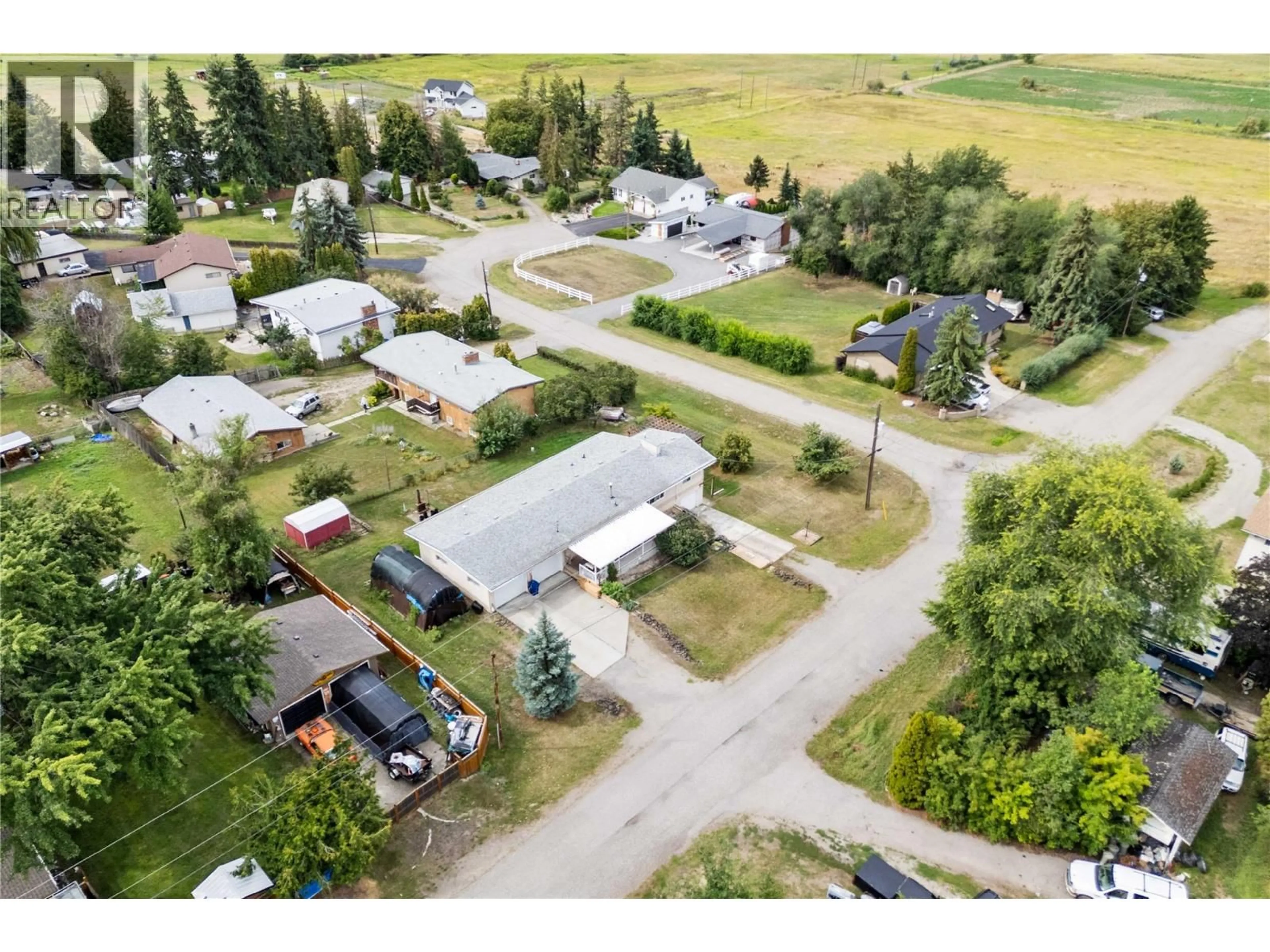 A pic from outside/outdoor area/front of a property/back of a property/a pic from drone, street for 616 DECOSMOS ROAD, Vernon British Columbia V1B3A9