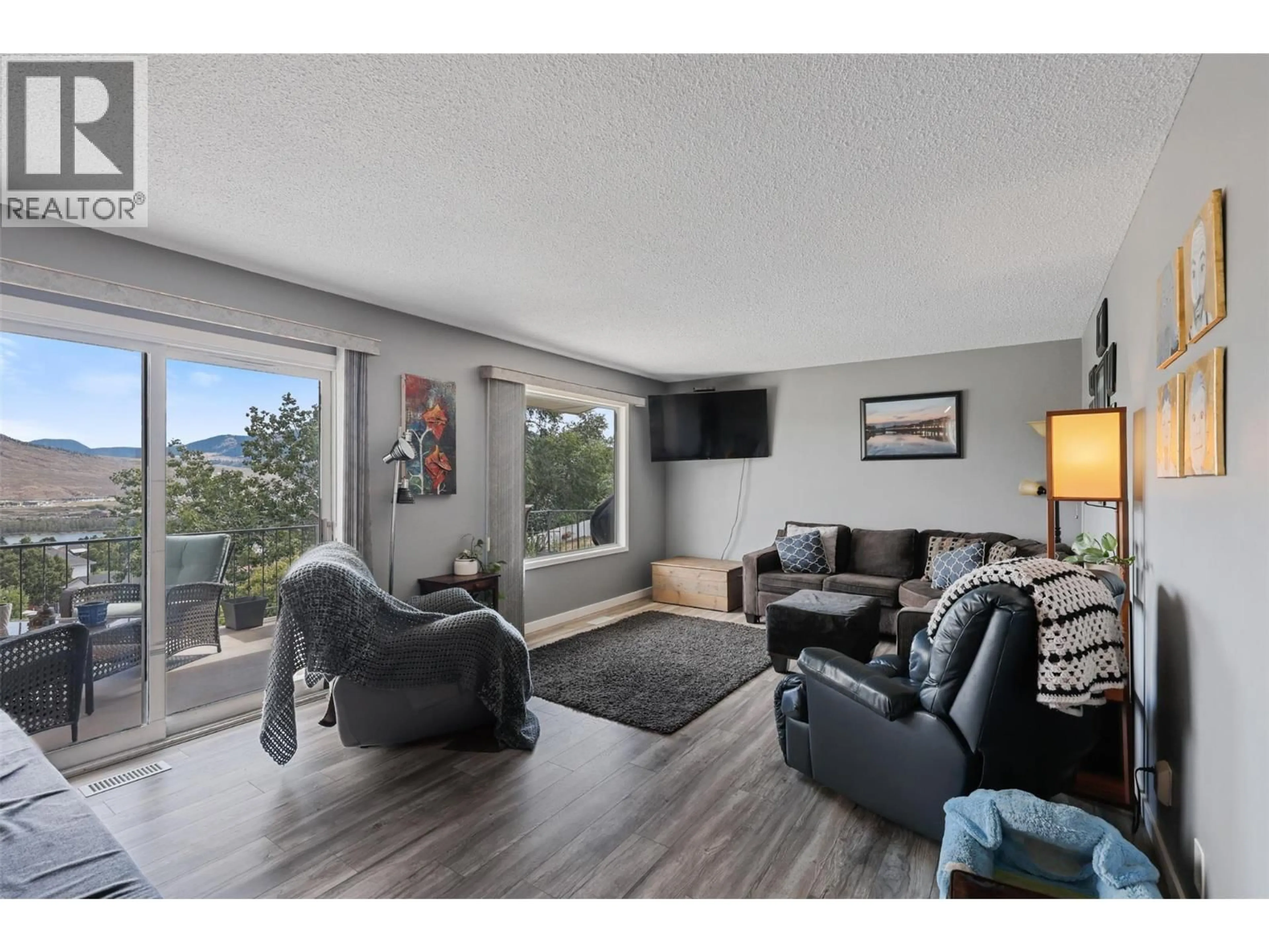Living room with furniture, wood/laminate floor for 1574 GRIFFIN TERRACE, Kamloops British Columbia V2B7R6