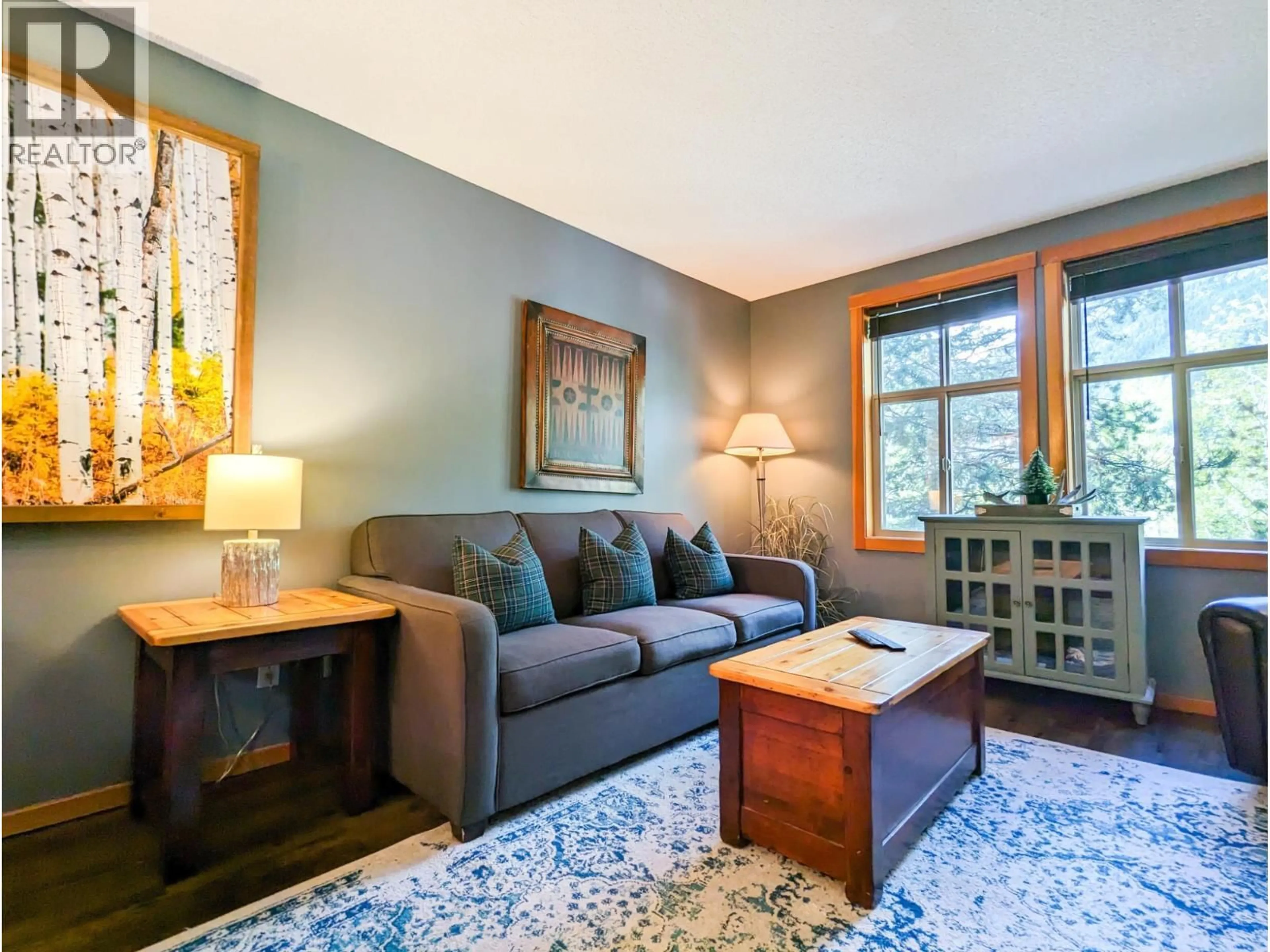 Living room with furniture, wood/laminate floor for 208 - 2060 SUMMIT DRIVE, Panorama British Columbia V0A1T0